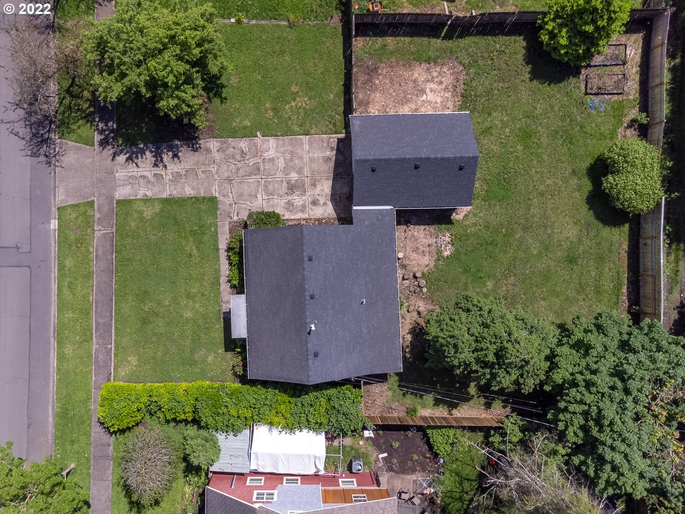 1147 F Street Springfield, OR 97477 - Photo 3 of 32 an aerial view of a house with a garden and yard