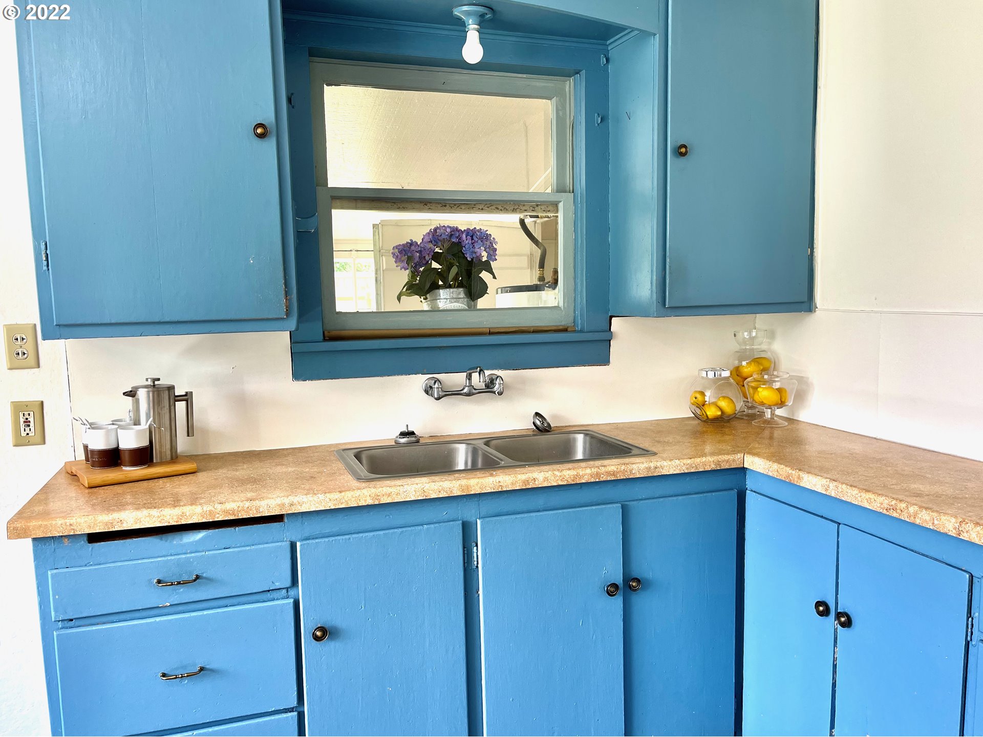 1147 F Street Springfield, OR 97477 - Photo 10 of 32 a kitchen with a sink and cabinets