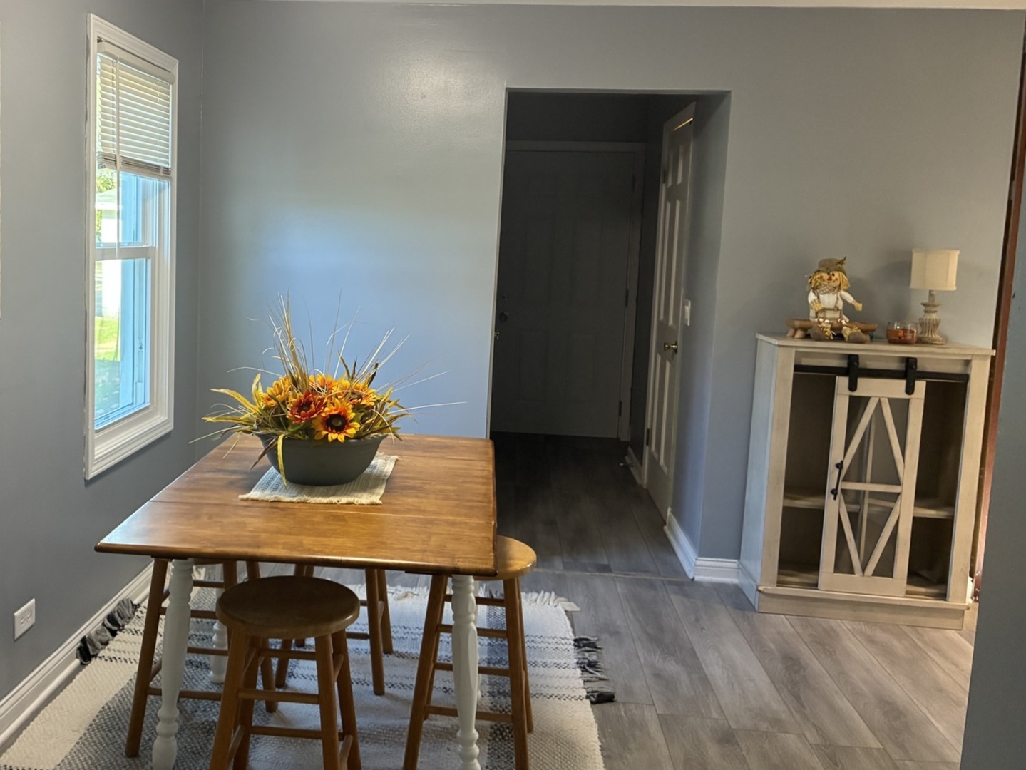3003 Elizabeth Avenue Zion, IL 60099 - Photo 12 of 30 a view of a dining room with furniture and wooden floor
