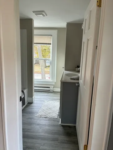 a bathroom with a sink vanity and a mirror