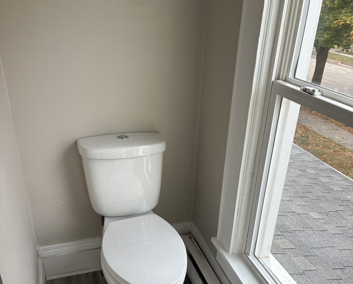 3003 Elizabeth Avenue Zion, IL 60099 - Photo 19 of 30 a white toilet sitting next to a window