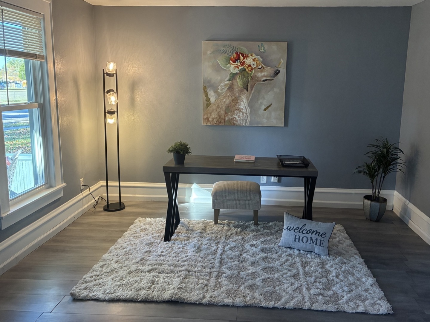 3003 Elizabeth Avenue Zion, IL 60099 - Photo 5 of 30 a living room with furniture a wooden floor and a potted plant
