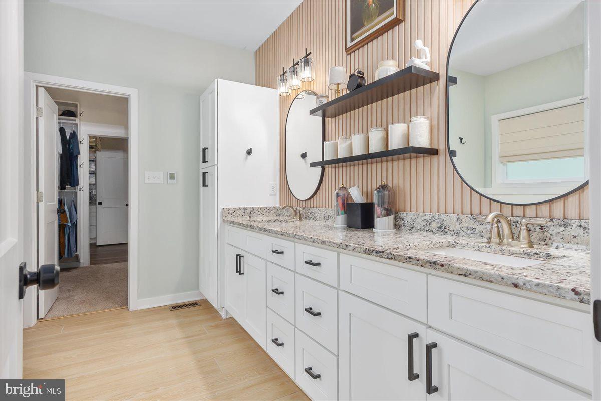 2390 Shirley Road Charles Town, WV 25414 - Photo 37 of 69 a bathroom with double vanity sink and a mirror