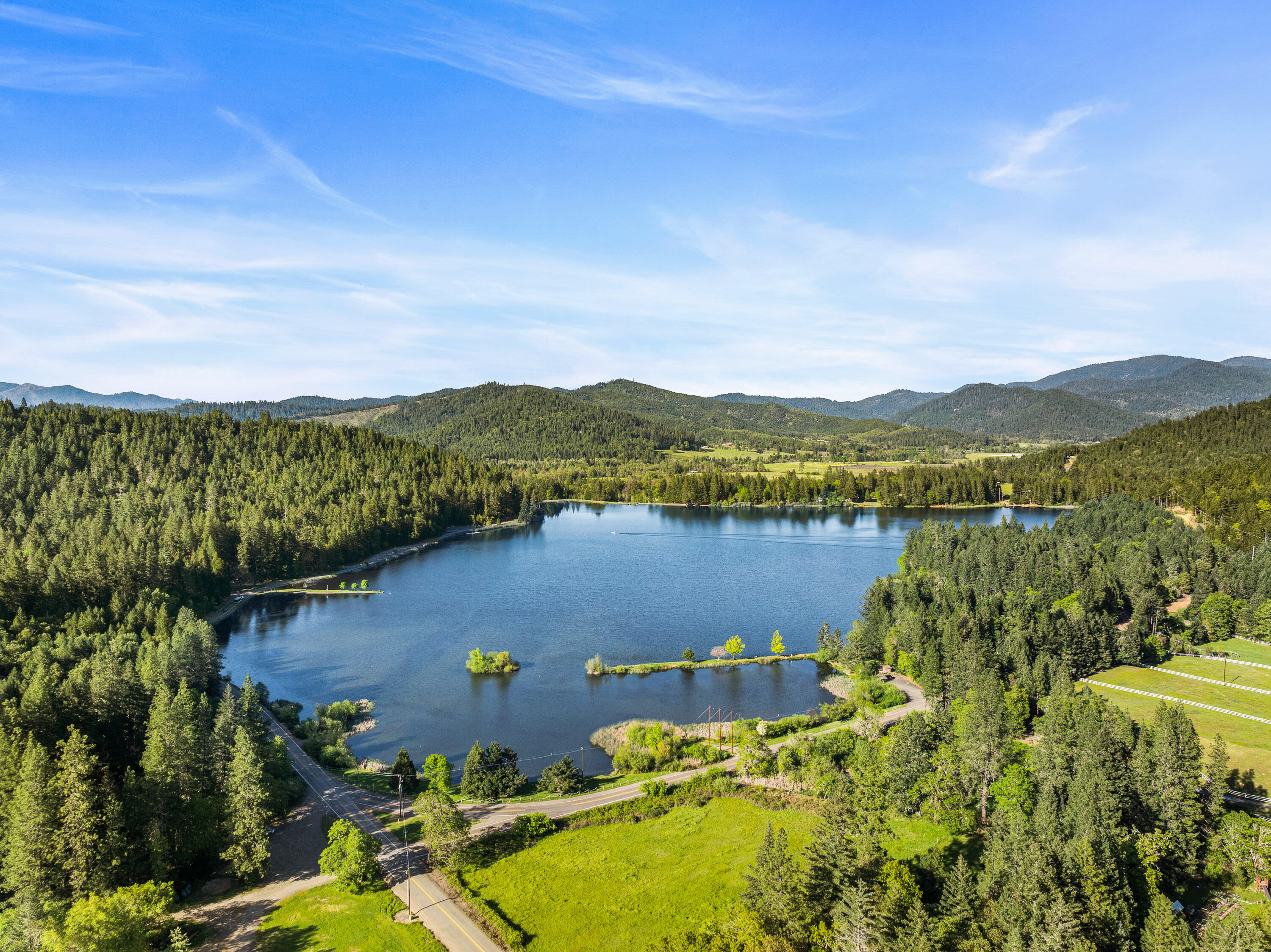 1201 Reeves Creek Road Selma, OR 97538 - Photo 36 of 38 a view of a lake with a mountain