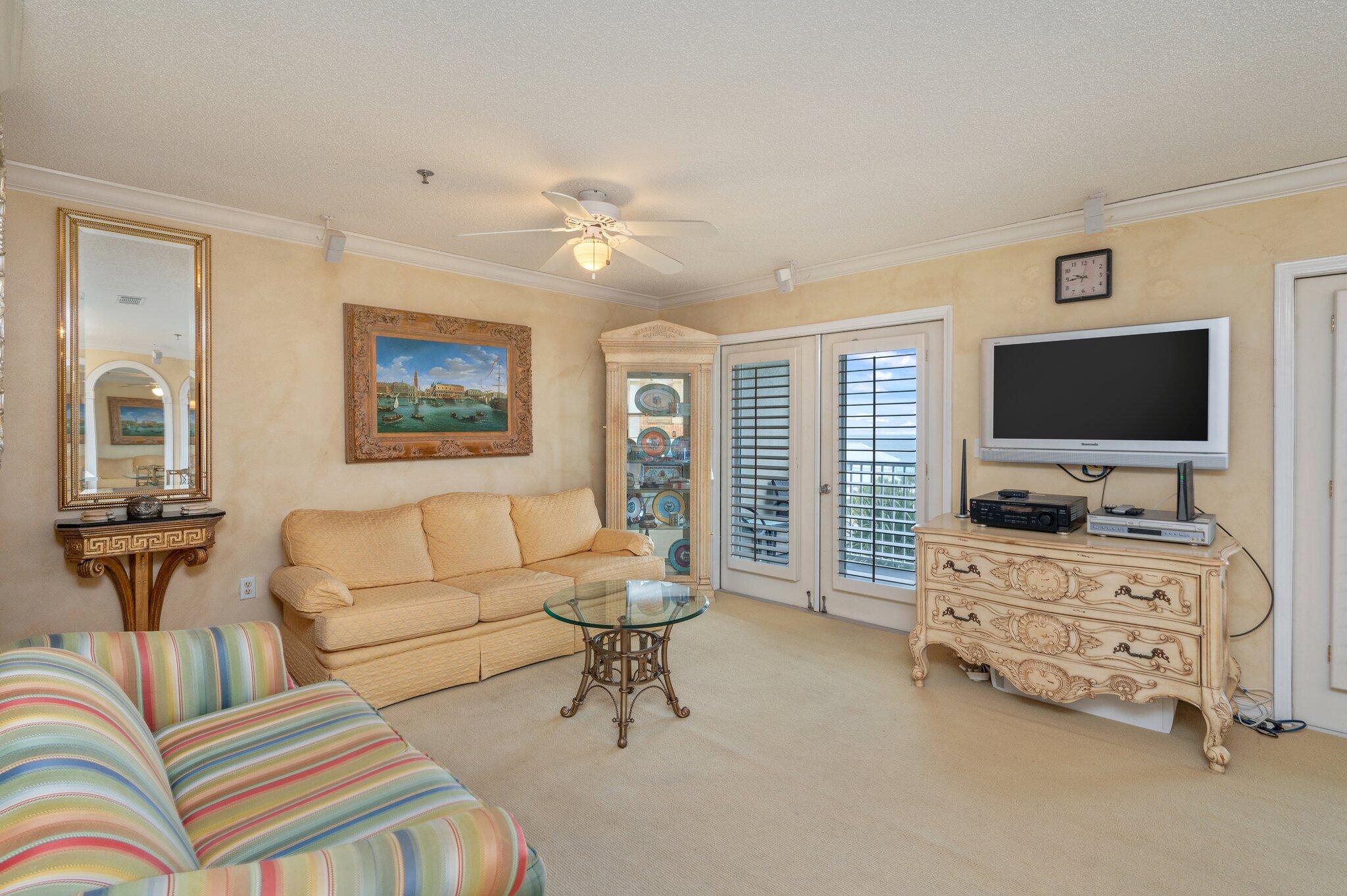 144 Spires Lane, Unit 403 Santa Rosa Beach, FL 32459 - Photo 17 of 38 a living room with furniture and a flat screen tv