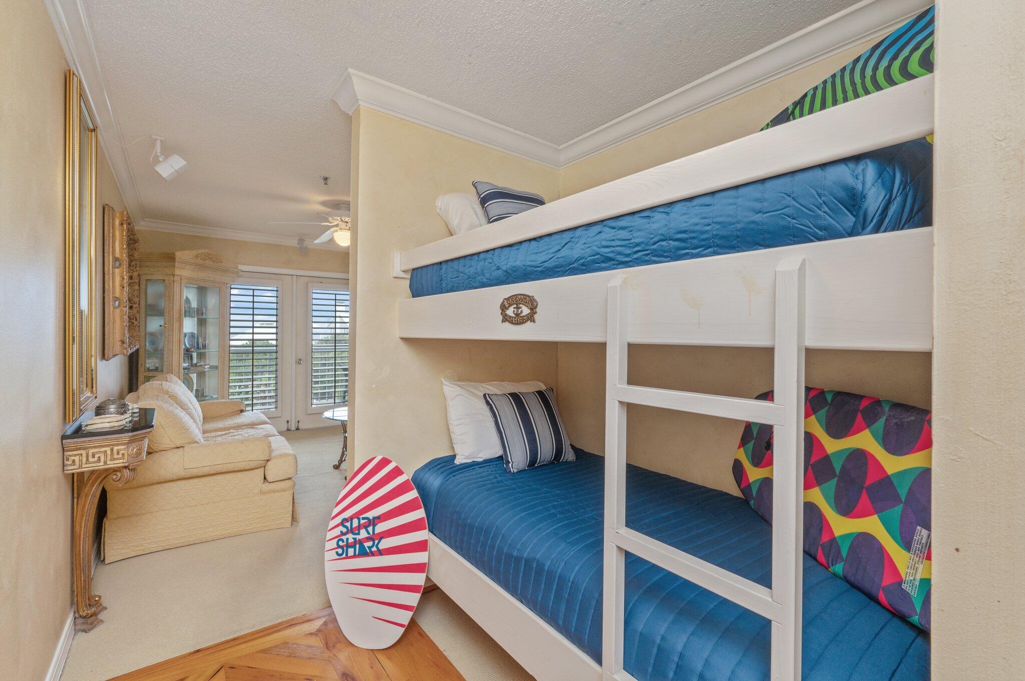 144 Spires Lane, Unit 403 Santa Rosa Beach, FL 32459 - Photo 19 of 38 a bedroom with a bed and glass window