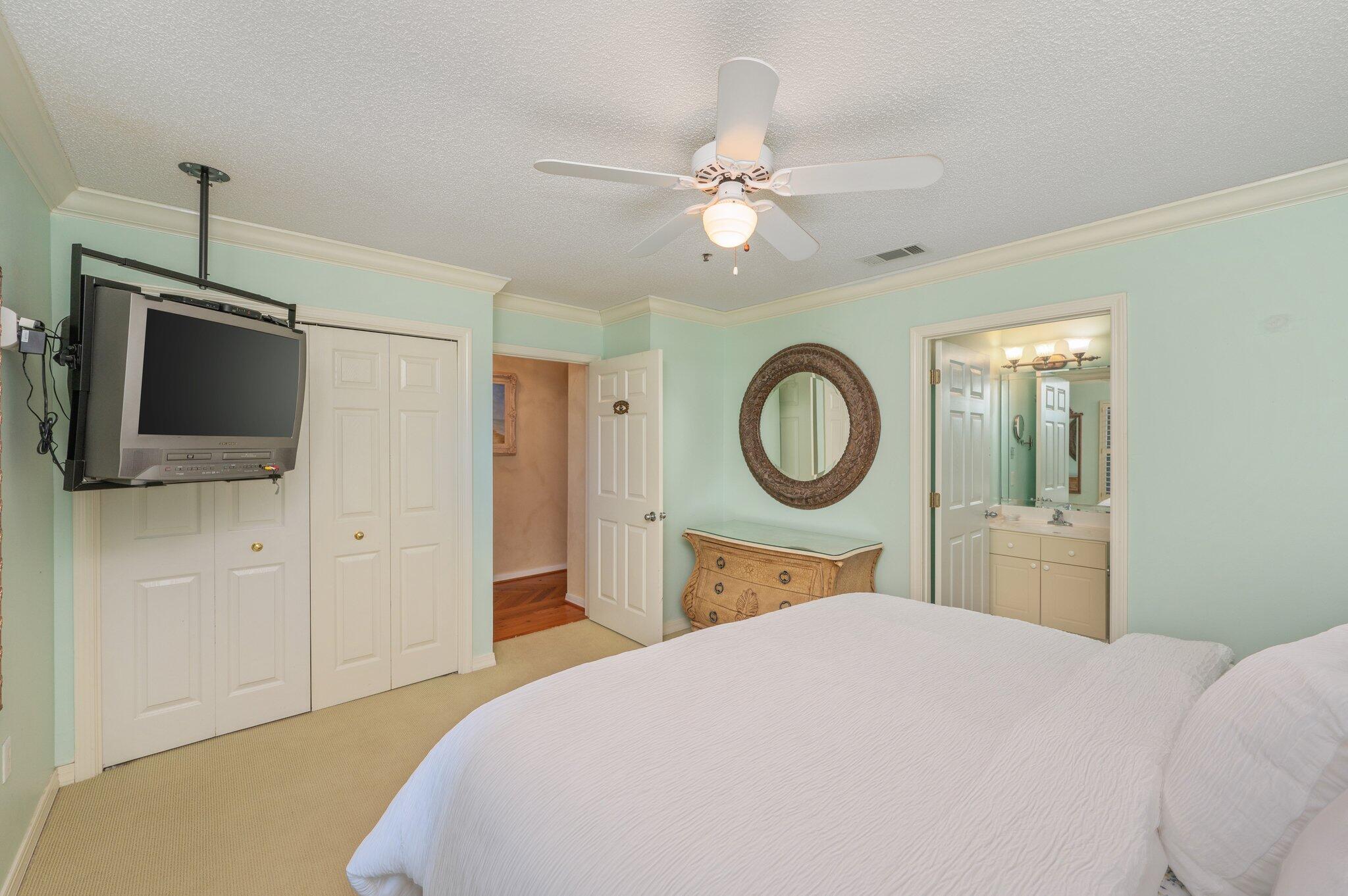 144 Spires Lane, Unit 403 Santa Rosa Beach, FL 32459 - Photo 23 of 38 a bedroom with a bed and a flat tv screen on dresser