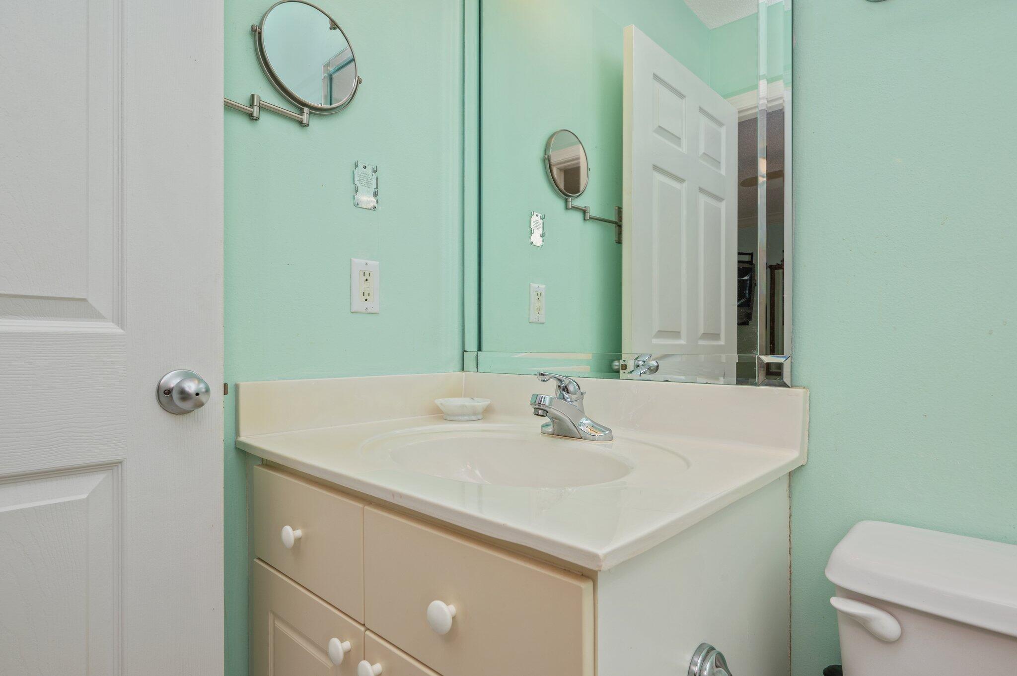 144 Spires Lane, Unit 403 Santa Rosa Beach, FL 32459 - Photo 24 of 38 a bathroom with a sink and a mirror