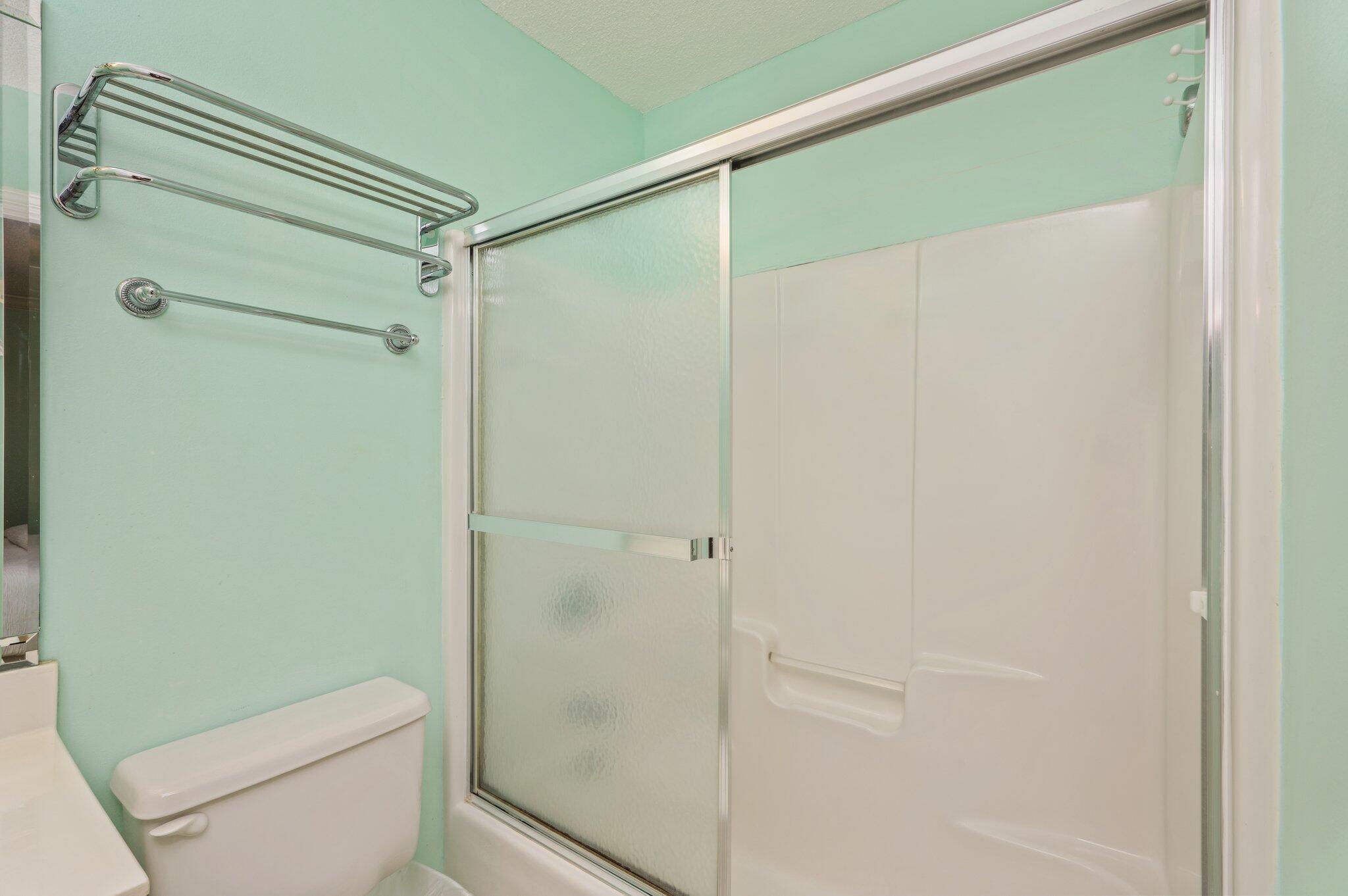 144 Spires Lane, Unit 403 Santa Rosa Beach, FL 32459 - Photo 25 of 38 a bathroom with a shower and a toilet