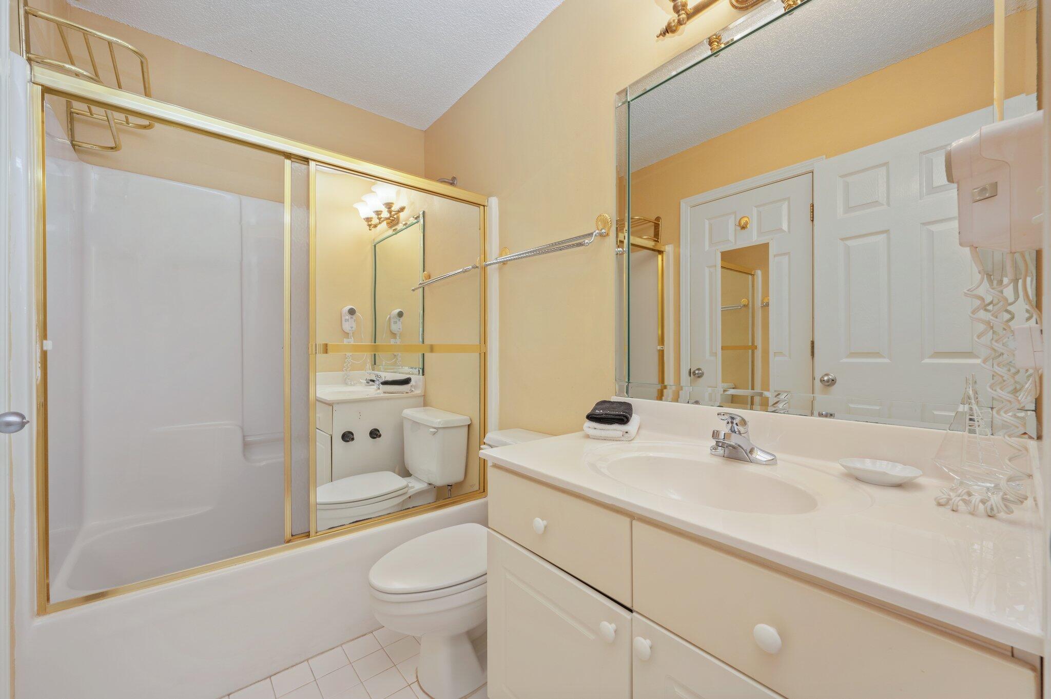 144 Spires Lane, Unit 403 Santa Rosa Beach, FL 32459 - Photo 28 of 38 a bathroom with a sink a toilet and shower