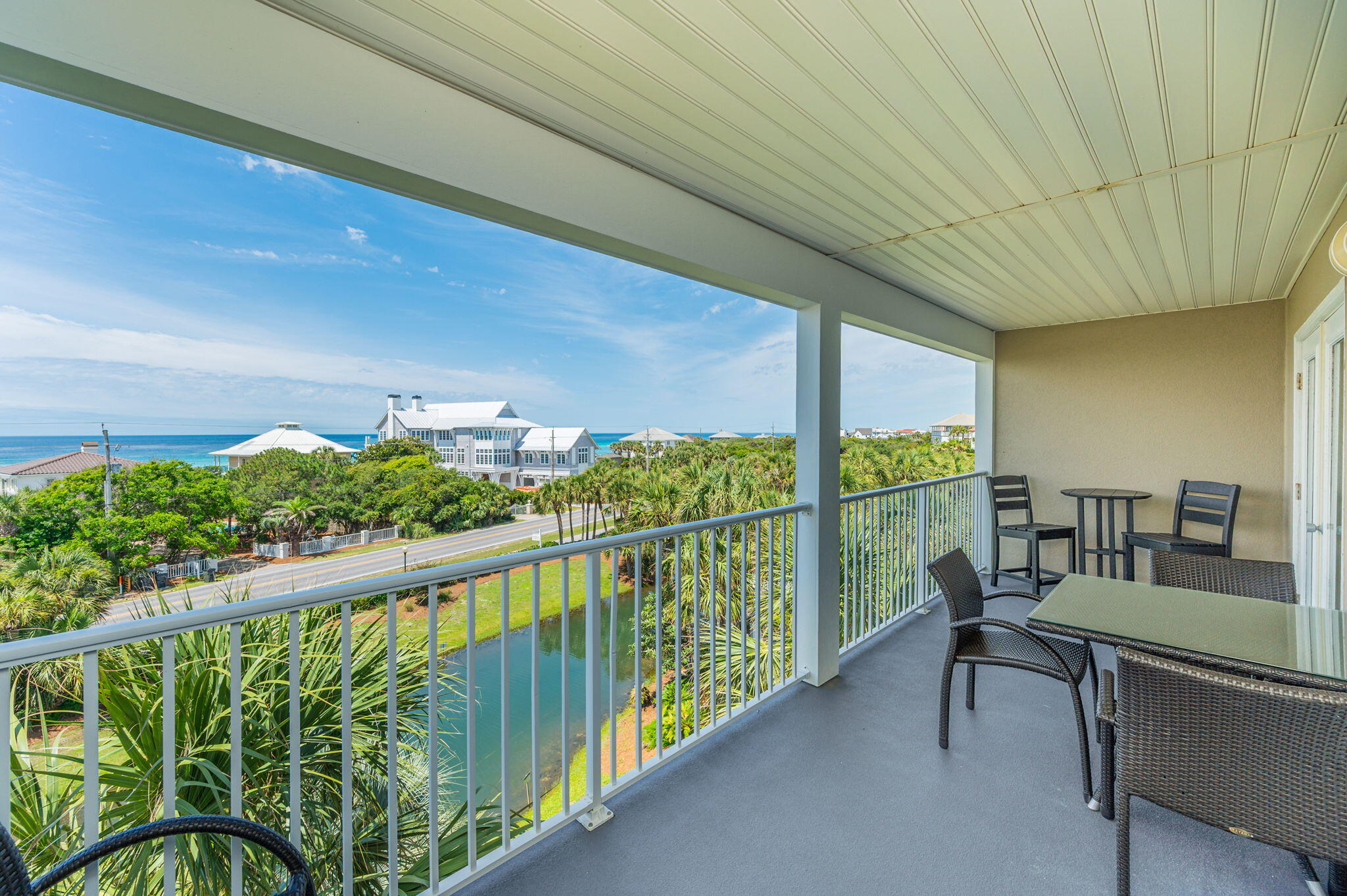 144 Spires Lane, Unit 403 Santa Rosa Beach, FL 32459 - Photo 32 of 38 a view of a chairs and table in patio of a house