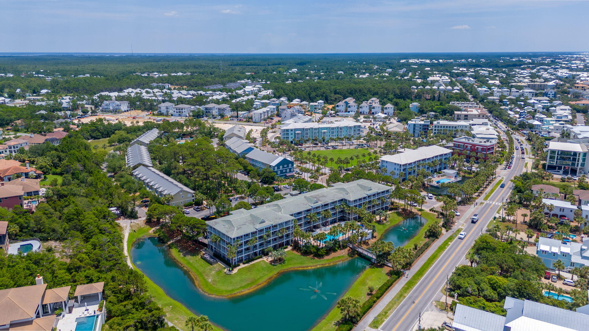 144 Spires Lane, Unit 403 Santa Rosa Beach, FL 32459 - Photo 37 of 38 an aerial view of a house with a garden and lake view