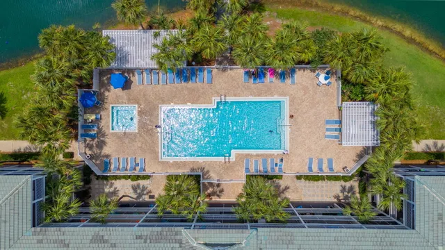 an aerial view of a house with garden space and street view