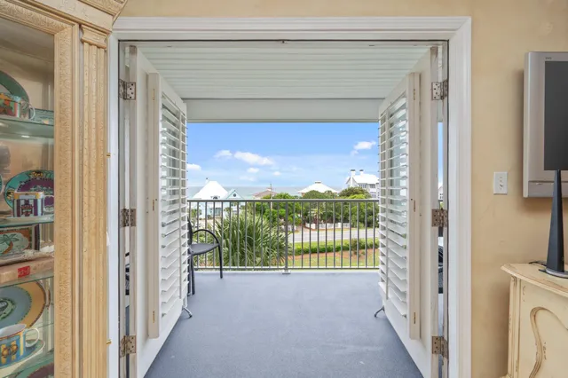 a view of a hallway with a large window and swimming pool