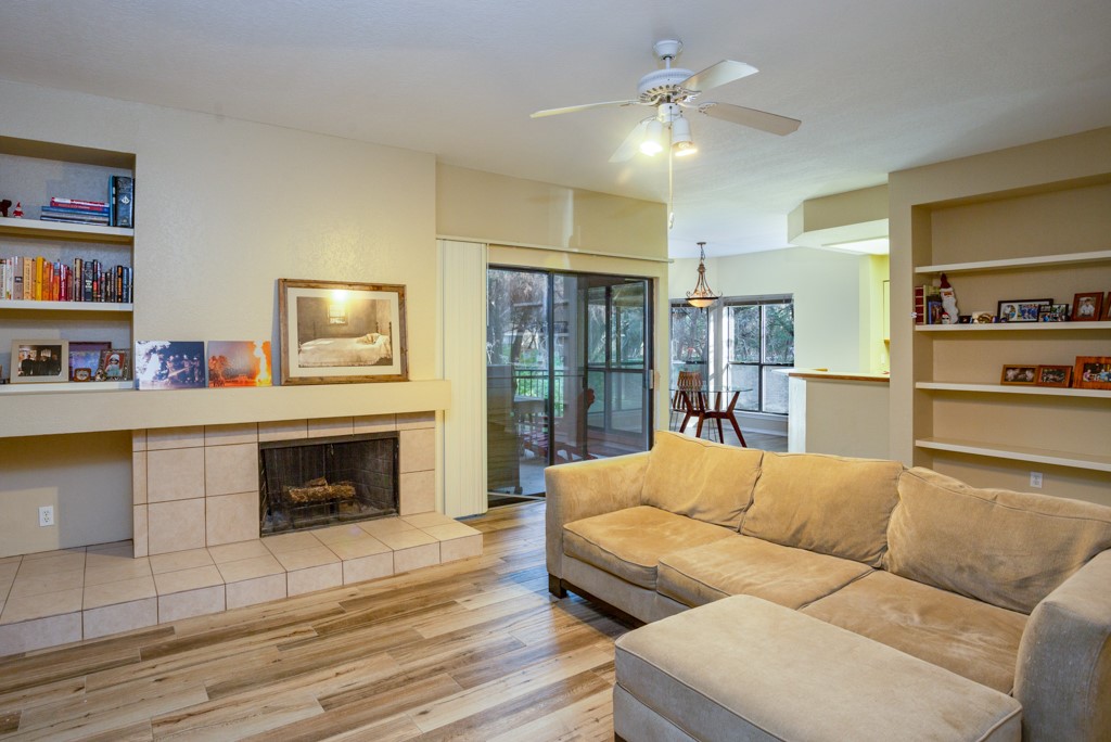 a living room with furniture and a fireplace
