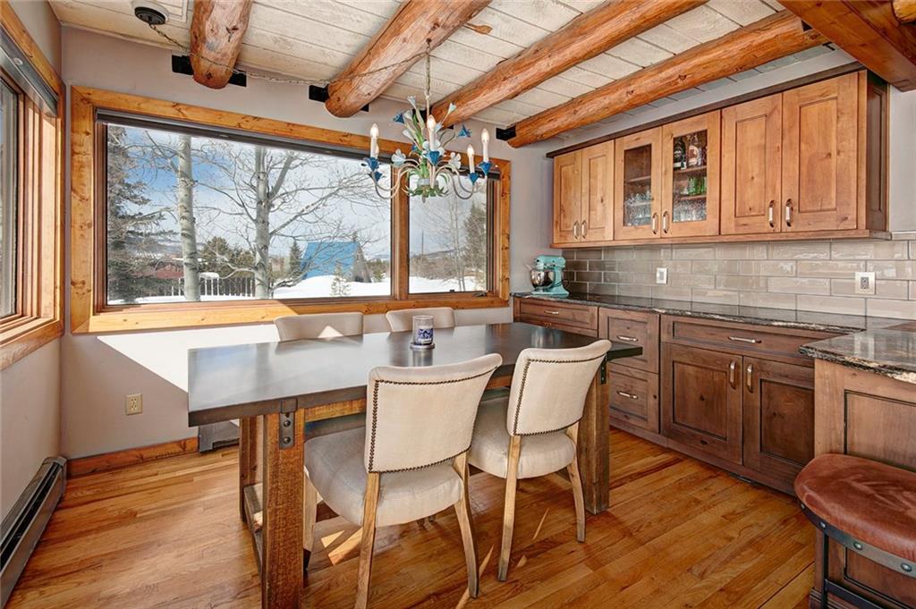 39 D Road Silverthorne, CO 80498 - Photo 12 of 35 a dining hall with stainless steel appliances granite countertop a sink and wooden cabinets