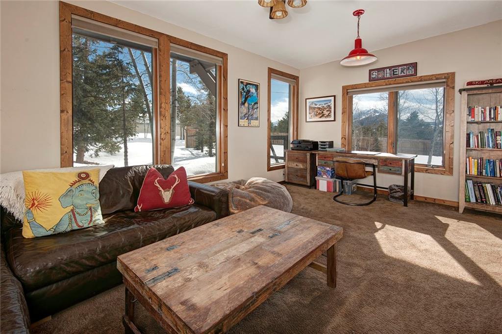 39 D Road Silverthorne, CO 80498 - Photo 15 of 35 a living room with furniture large window and wooden floor