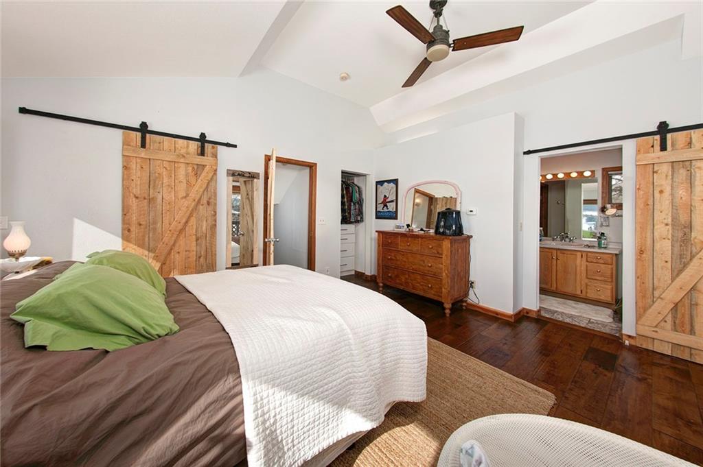 39 D Road Silverthorne, CO 80498 - Photo 19 of 35 a bedroom with a bed and wooden floor