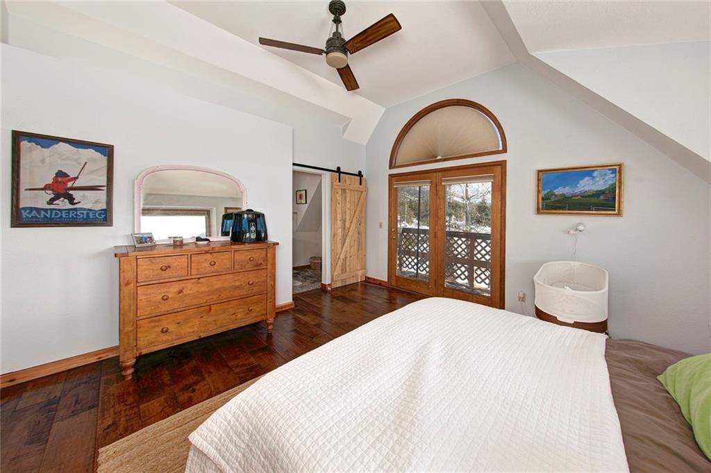 39 D Road Silverthorne, CO 80498 - Photo 21 of 35 a bedroom with a bed and dresser with mirror