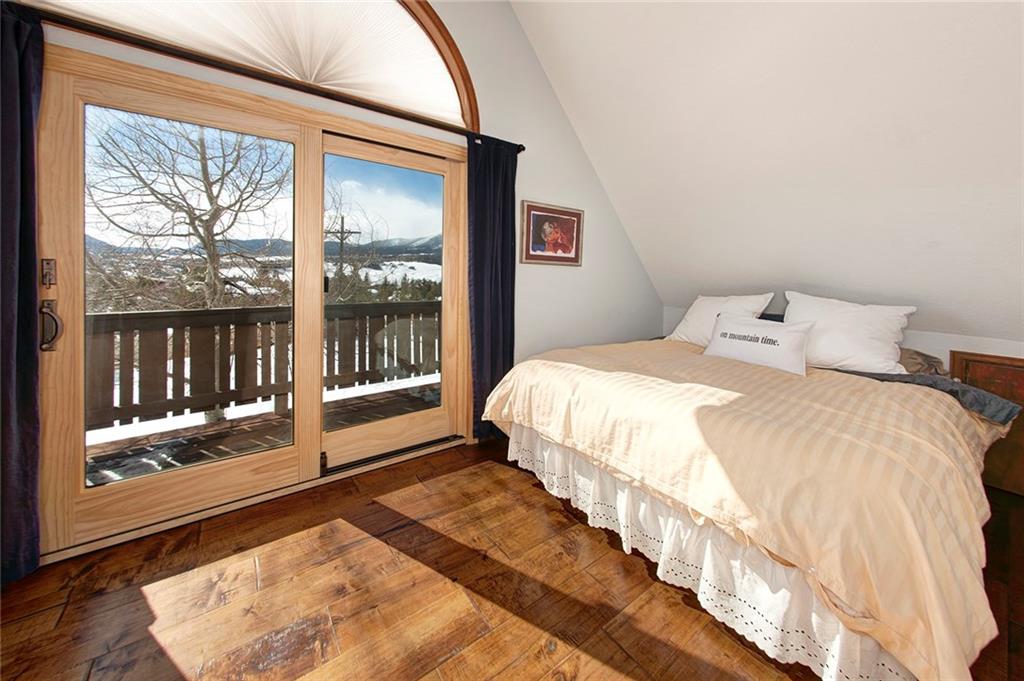 39 D Road Silverthorne, CO 80498 - Photo 22 of 35 a bedroom with a large bed and a large window