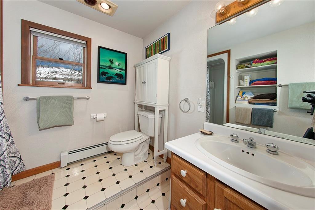 39 D Road Silverthorne, CO 80498 - Photo 29 of 35 a bathroom with a sink toilet and a mirror