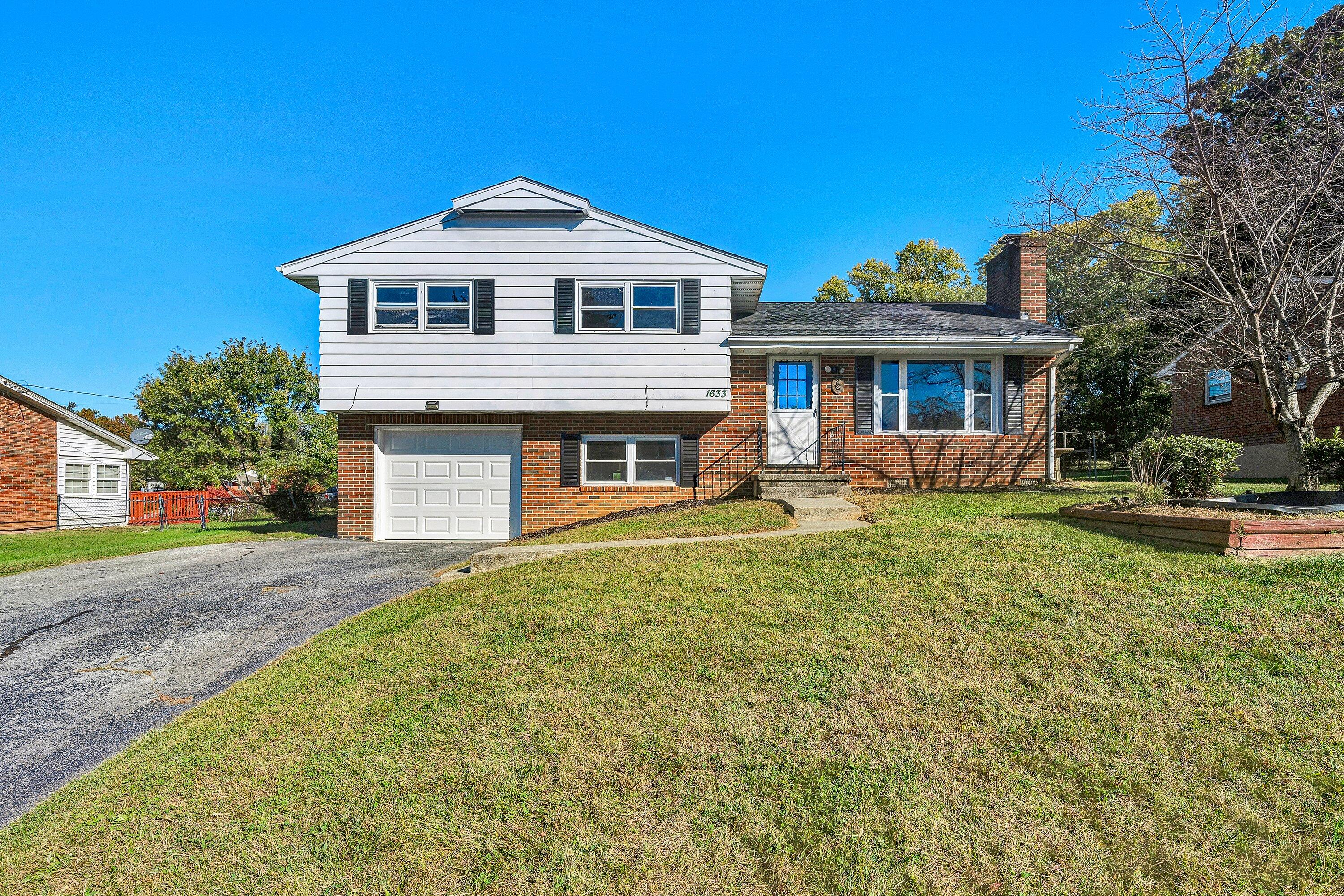 1633 Angus Road Northwest Roanoke, VA 24017 - Photo 1 of 22 a front view of a house with a yard