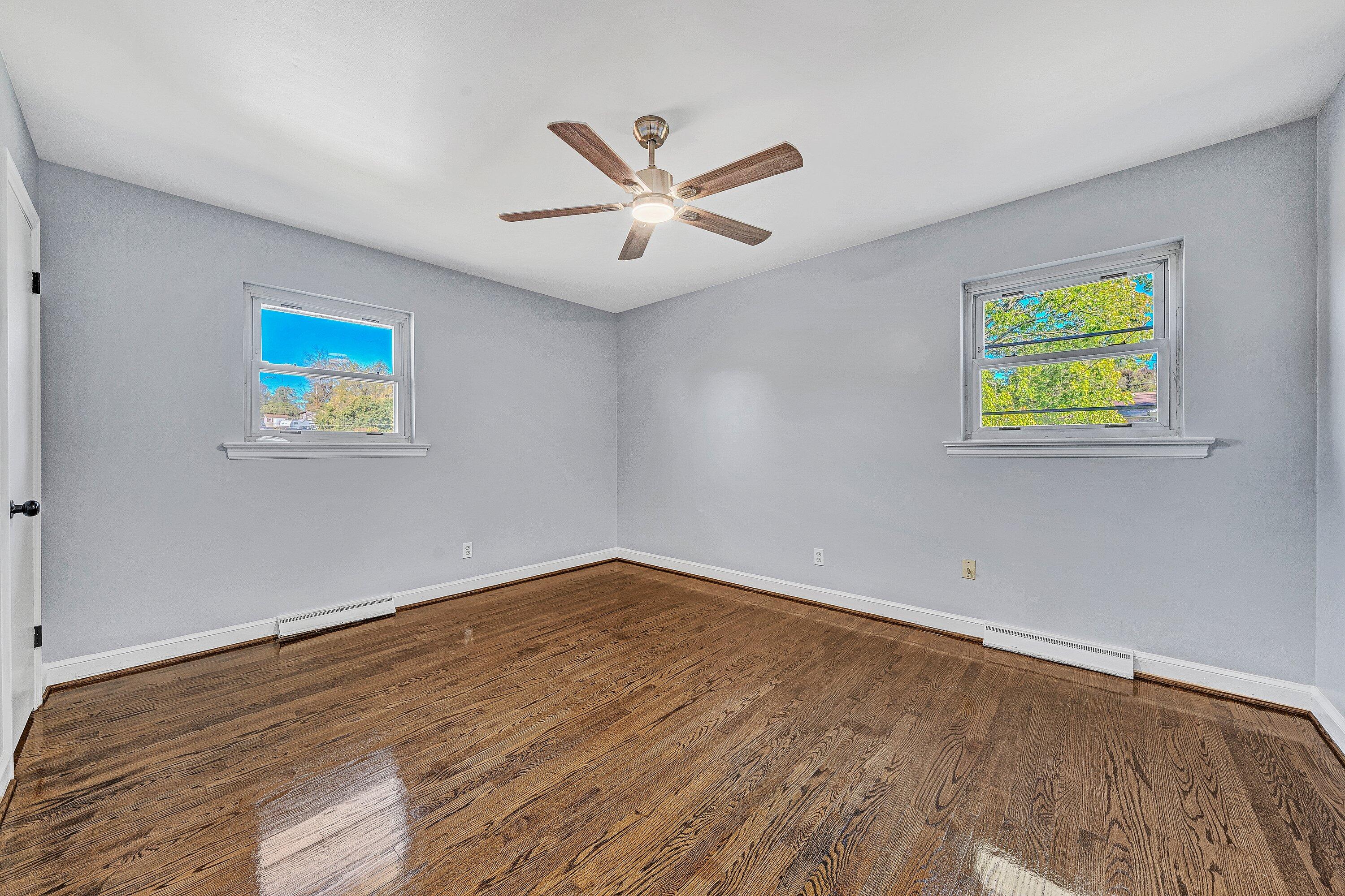1633 Angus Road Northwest Roanoke, VA 24017 - Photo 11 of 22 wooden floor in an empty room with a window