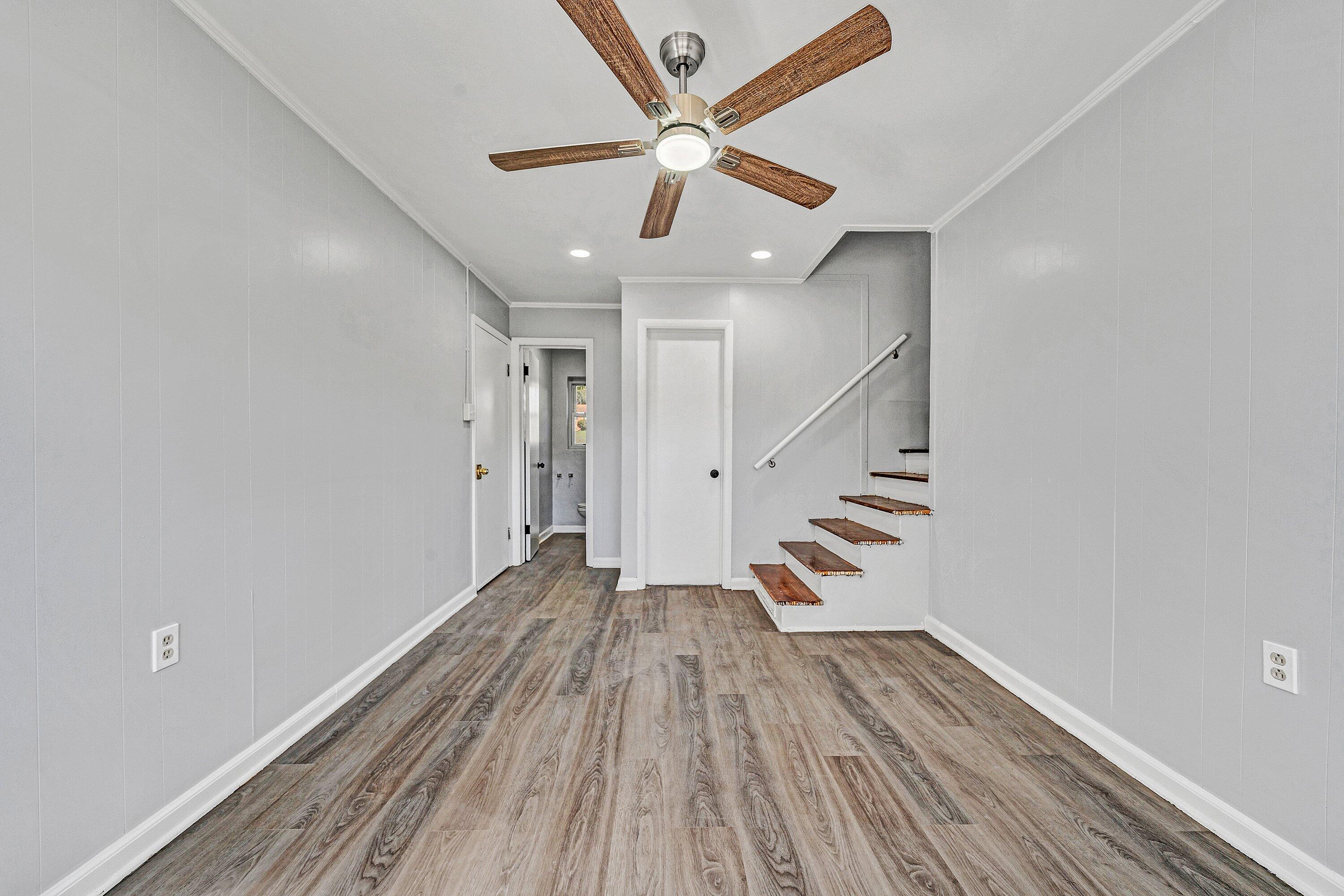 1633 Angus Road Northwest Roanoke, VA 24017 - Photo 16 of 22 wooden floor in an empty room with a window