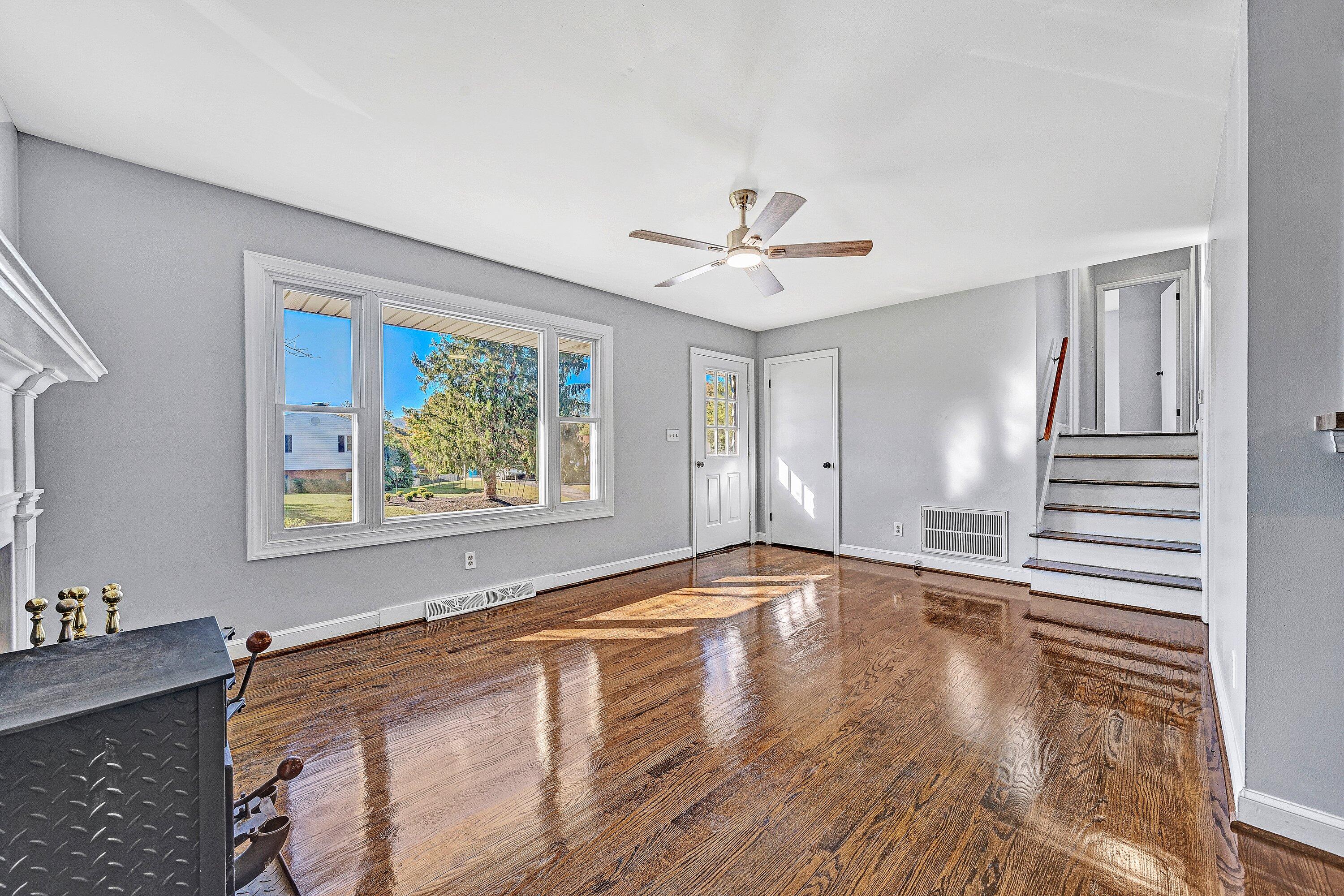 1633 Angus Road Northwest Roanoke, VA 24017 - Photo 4 of 22 a view of an empty room with window and wooden floor