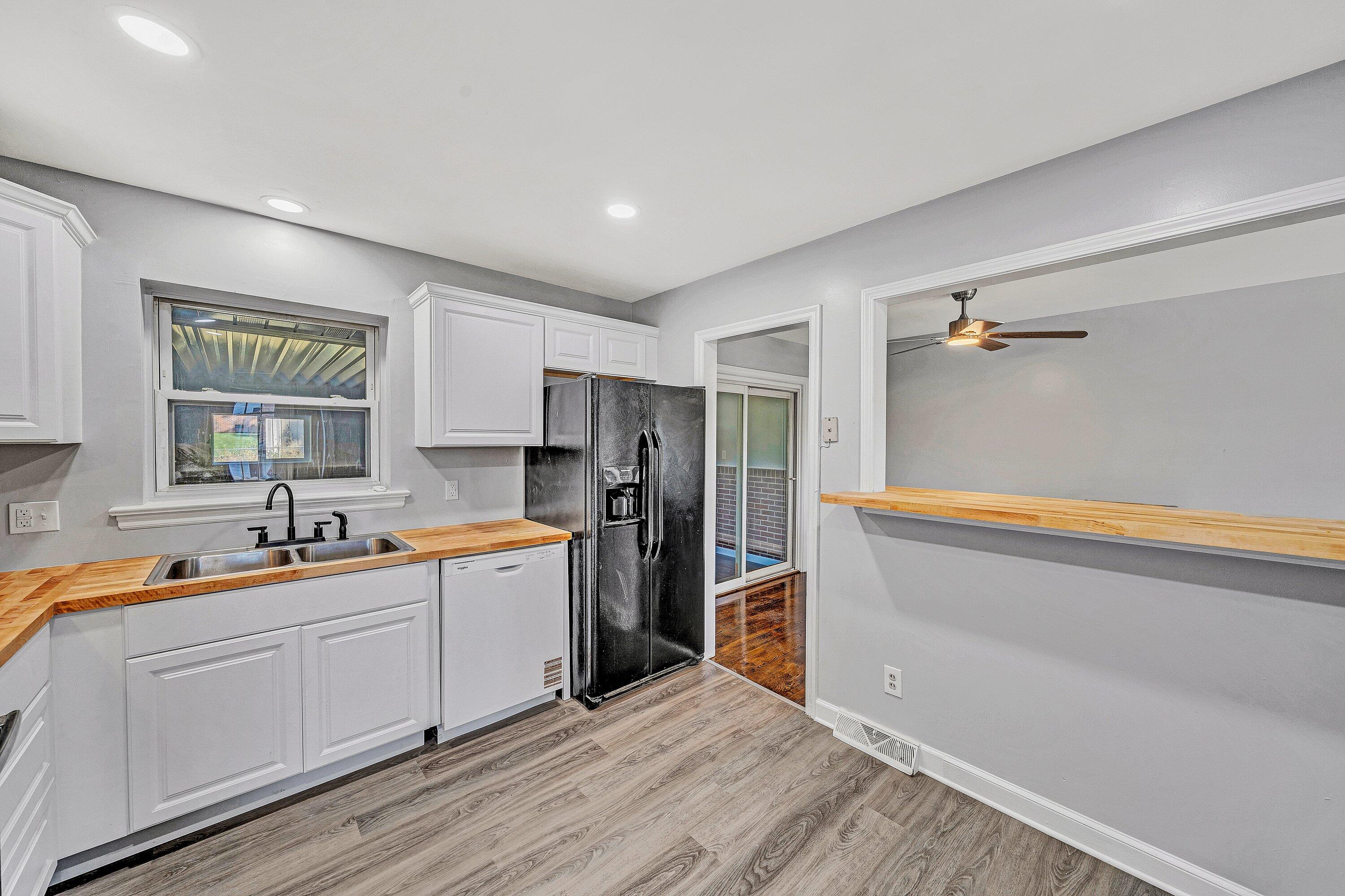 1633 Angus Road Northwest Roanoke, VA 24017 - Photo 5 of 22 a kitchen with a sink refrigerator and cabinets