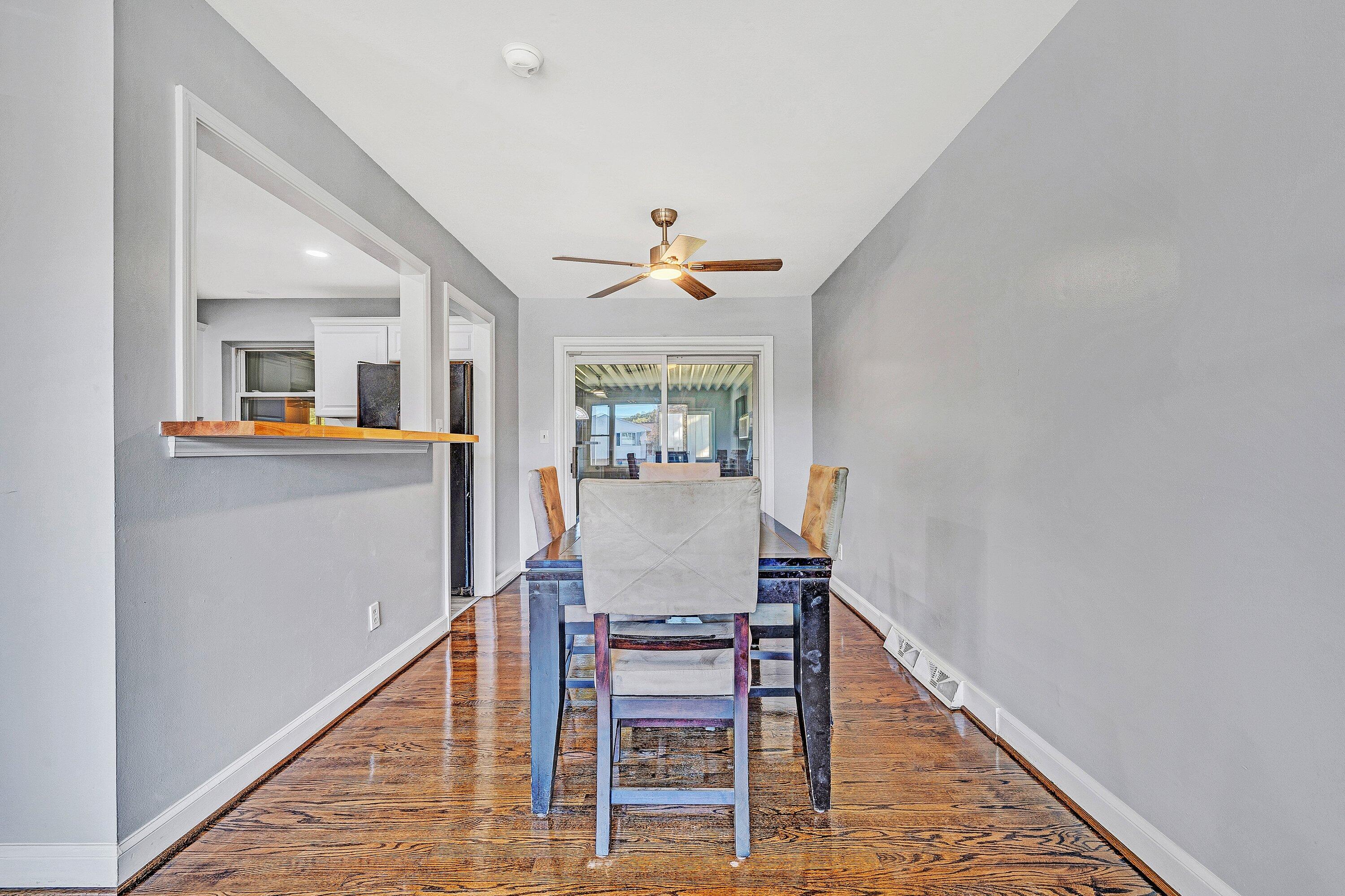 1633 Angus Road Northwest Roanoke, VA 24017 - Photo 7 of 22 a dining room with furniture window and wooden floor