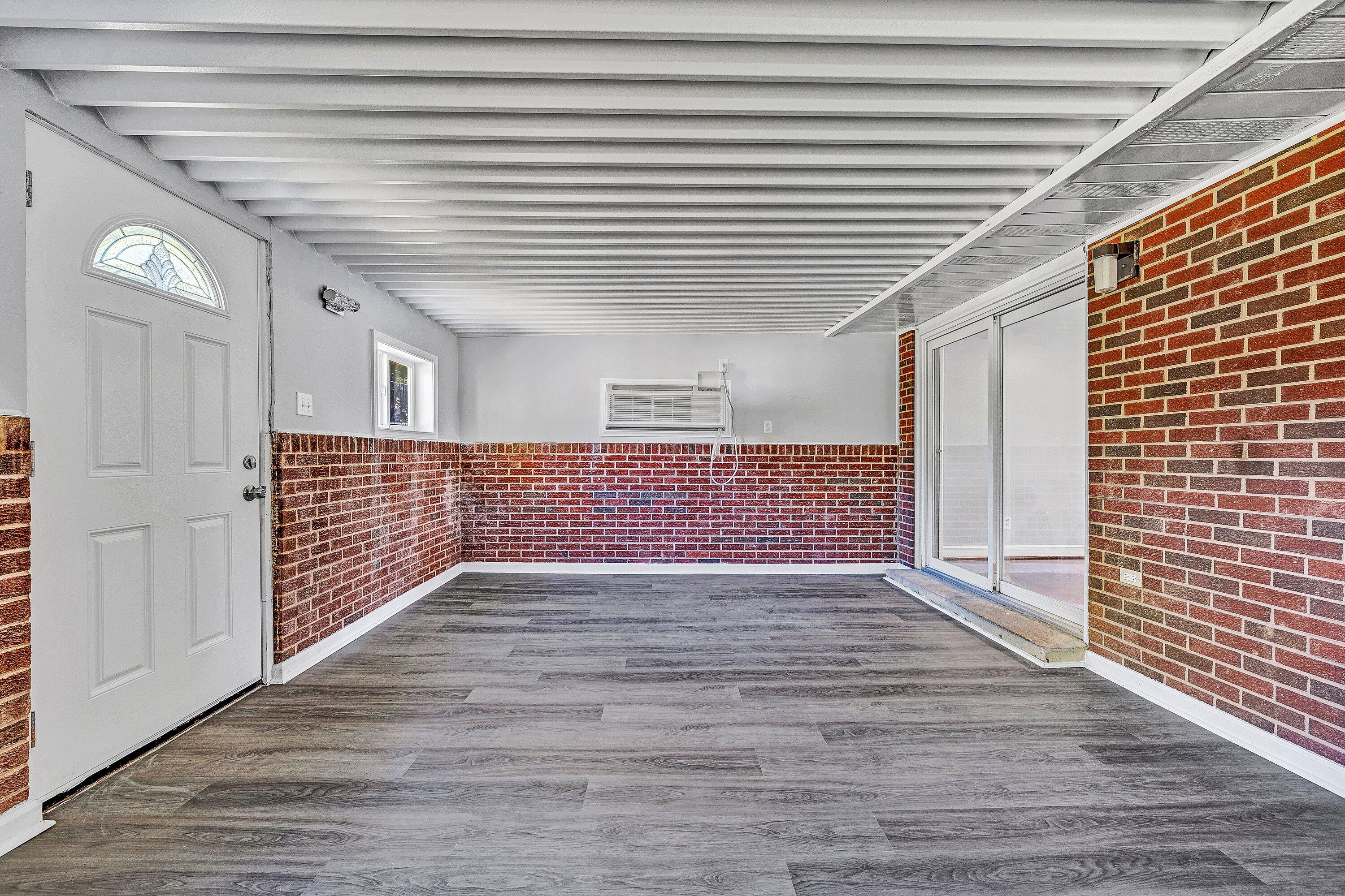 1633 Angus Road Northwest Roanoke, VA 24017 - Photo 9 of 22 a view of an empty room with wooden floor and a window