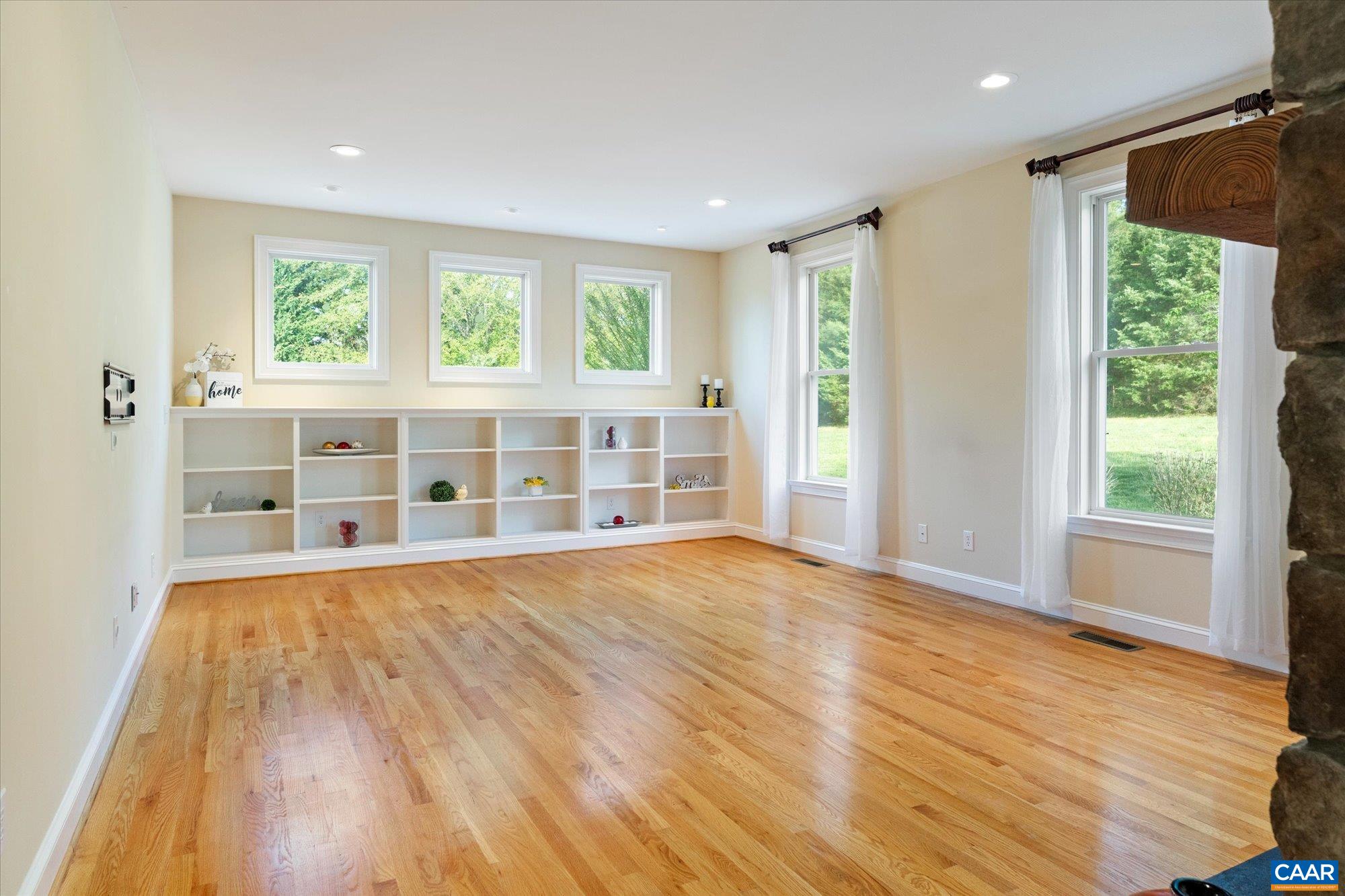 4269 Stony Point Road Keswick, VA 22947 - Photo 11 of 25 a view of an empty room with wooden floor and a window