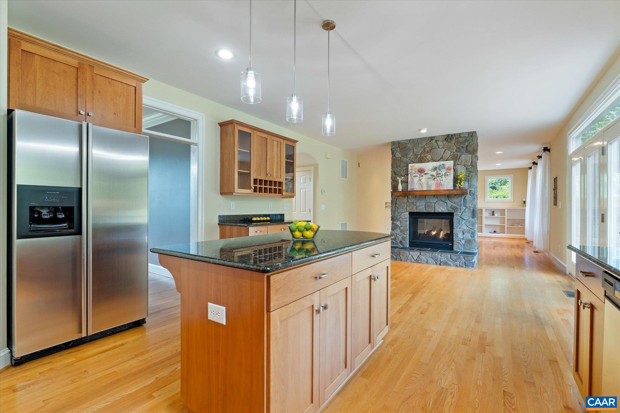 4269 Stony Point Road Keswick, VA 22947 - Photo 13 of 25 a kitchen with stainless steel appliances granite countertop a refrigerator a stove and a wooden floors