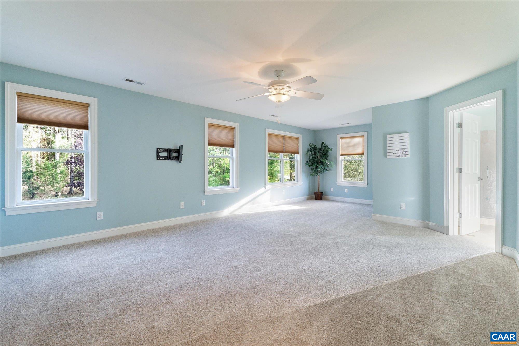 4269 Stony Point Road Keswick, VA 22947 - Photo 14 of 25 a view of empty room with windows and ceiling fan