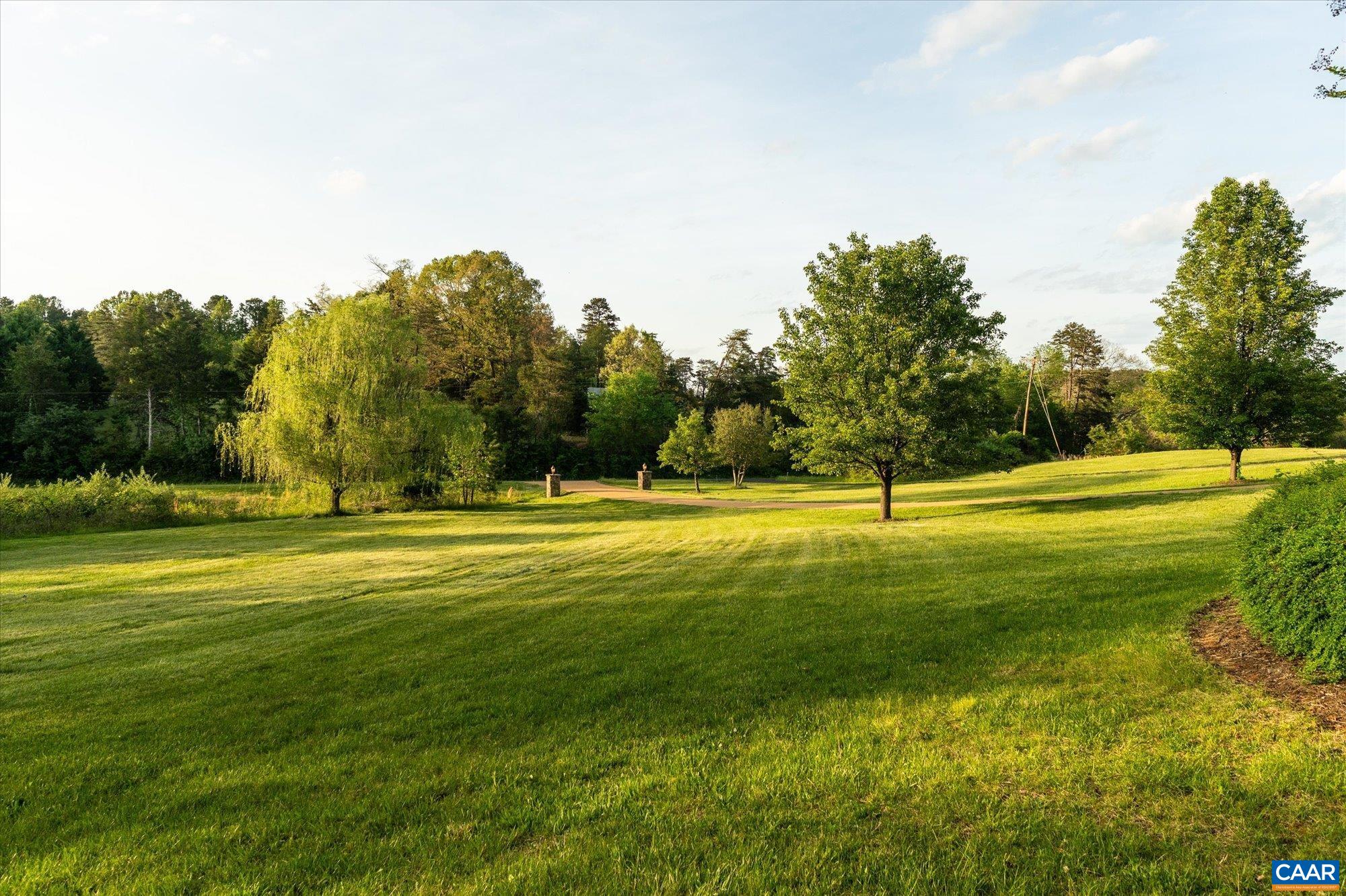 4269 Stony Point Road Keswick, VA 22947 - Photo 23 of 25 a view of a swimming pool with a big yard and large trees