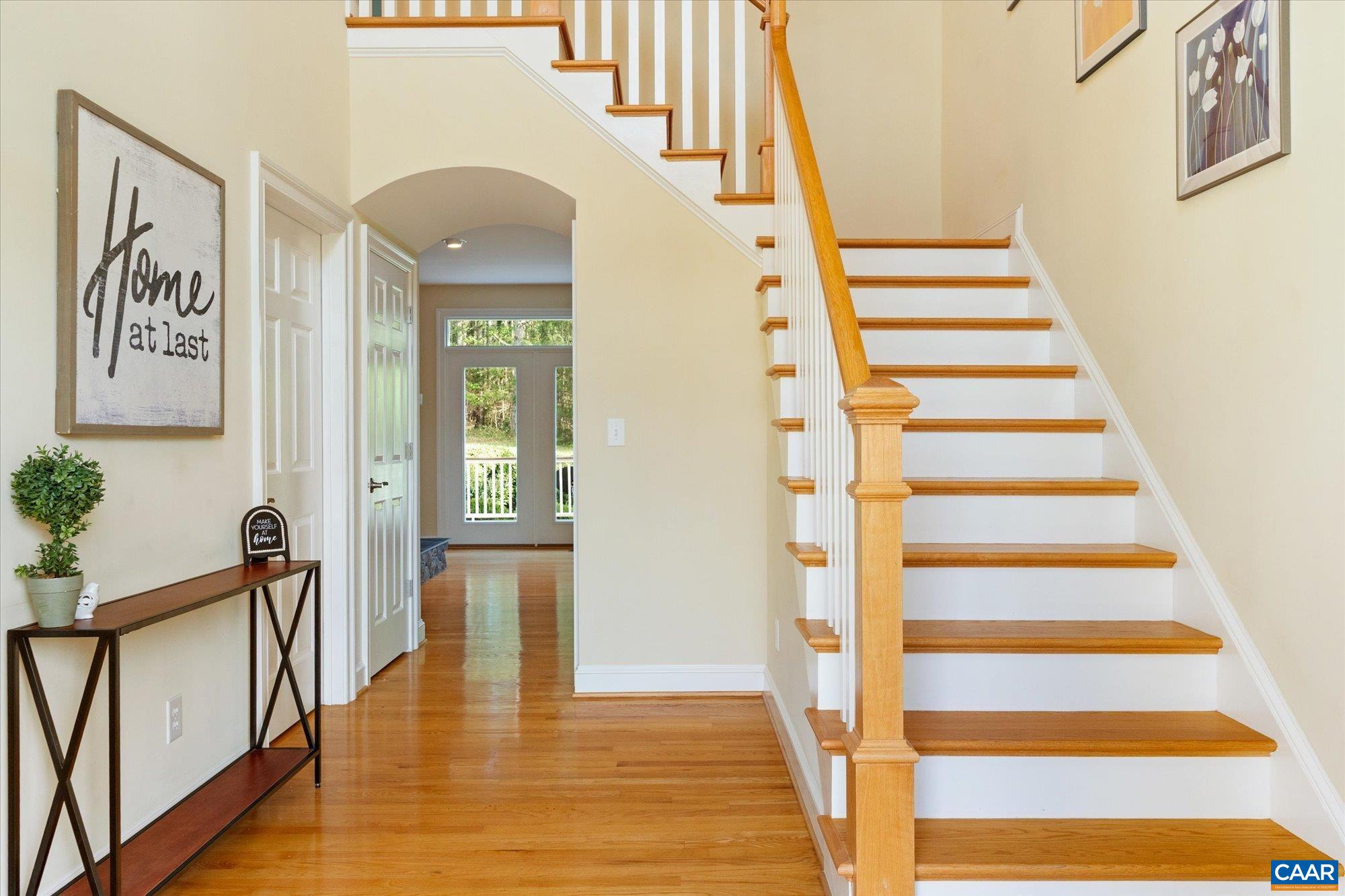 4269 Stony Point Road Keswick, VA 22947 - Photo 8 of 25 a view of a hallway with wooden floor and staircase