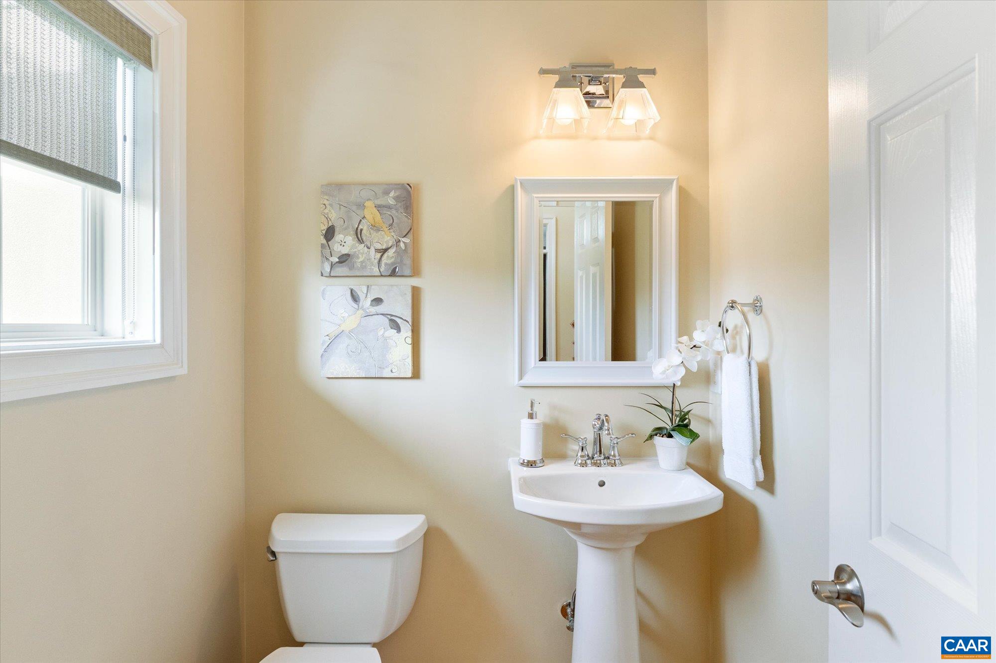4269 Stony Point Road Keswick, VA 22947 - Photo 9 of 25 a bathroom with a sink and mirror with toilet