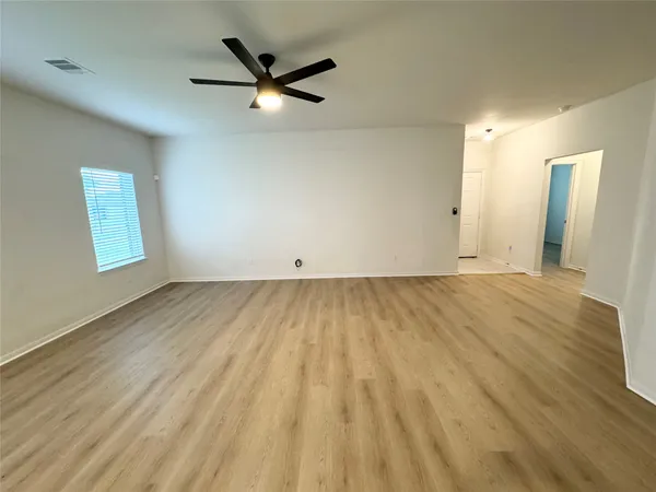 a kitchen with stainless steel appliances granite countertop a stove a refrigerator a sink a microwave and island