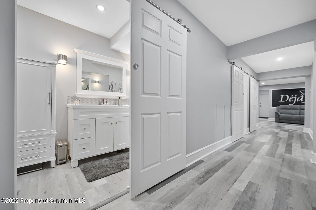 1307 Summit Pointe Scranton, PA 18508 - Photo 32 of 43 a bathroom with a sink and a mirror