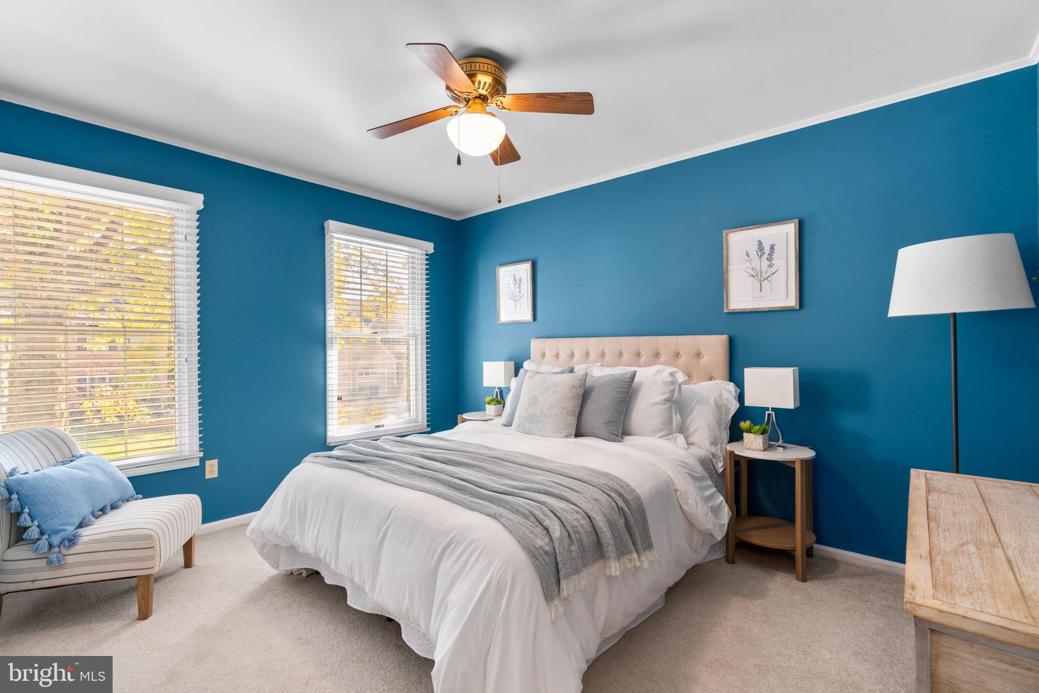 311 Canterfield Road Annapolis, MD 21403 - Photo 23 of 49 a bedroom with a bed and a chandelier