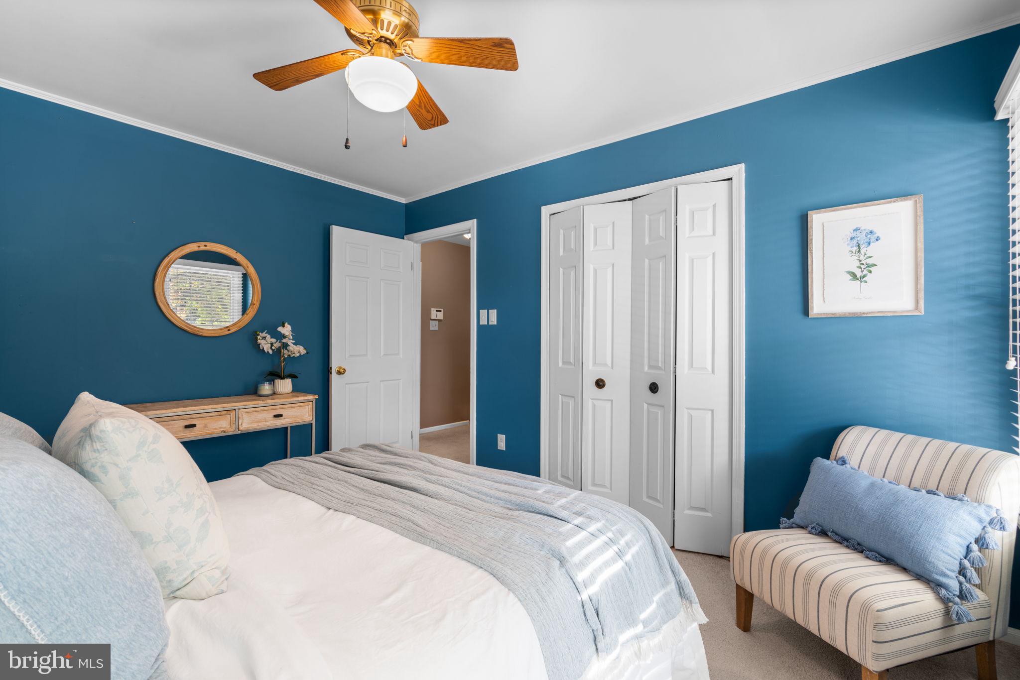 311 Canterfield Road Annapolis, MD 21403 - Photo 24 of 49 a bedroom with bed and a chandelier