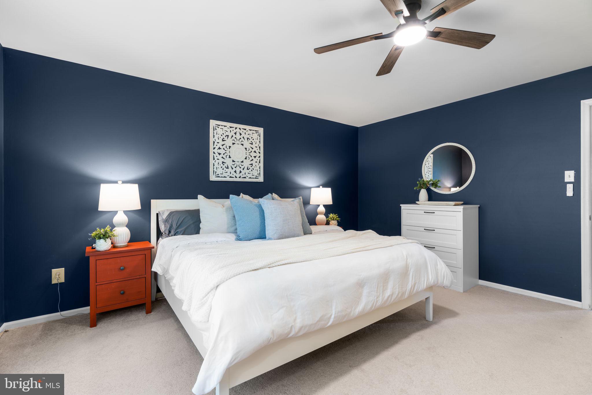 311 Canterfield Road Annapolis, MD 21403 - Photo 27 of 49 a bedroom with bed and a chandelier