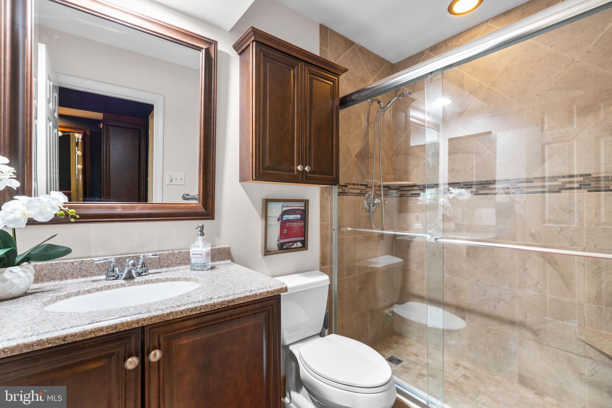 311 Canterfield Road Annapolis, MD 21403 - Photo 30 of 49 a bathroom with a granite countertop sink toilet and shower