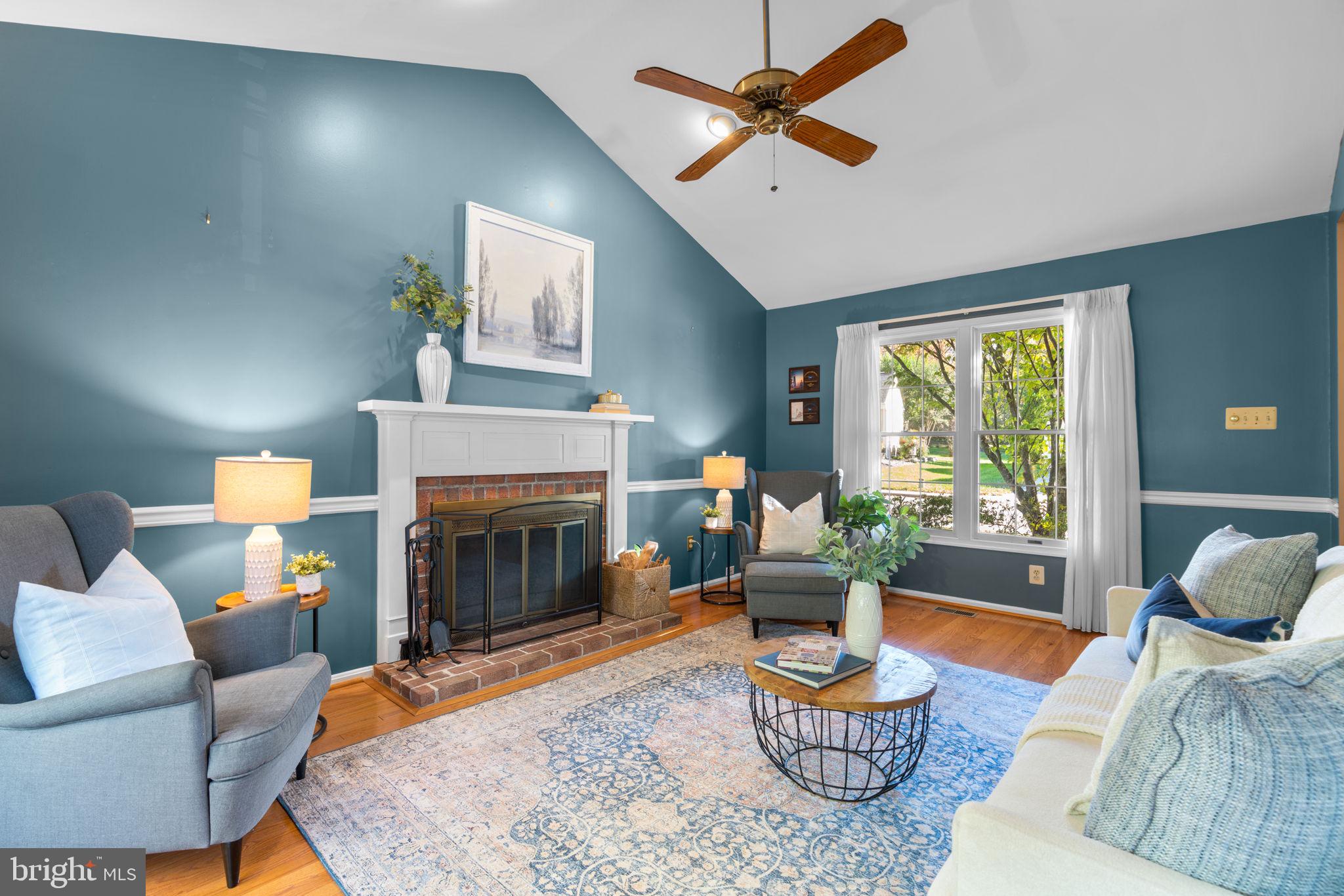 311 Canterfield Road Annapolis, MD 21403 - Photo 3 of 49 a living room with furniture and a fireplace