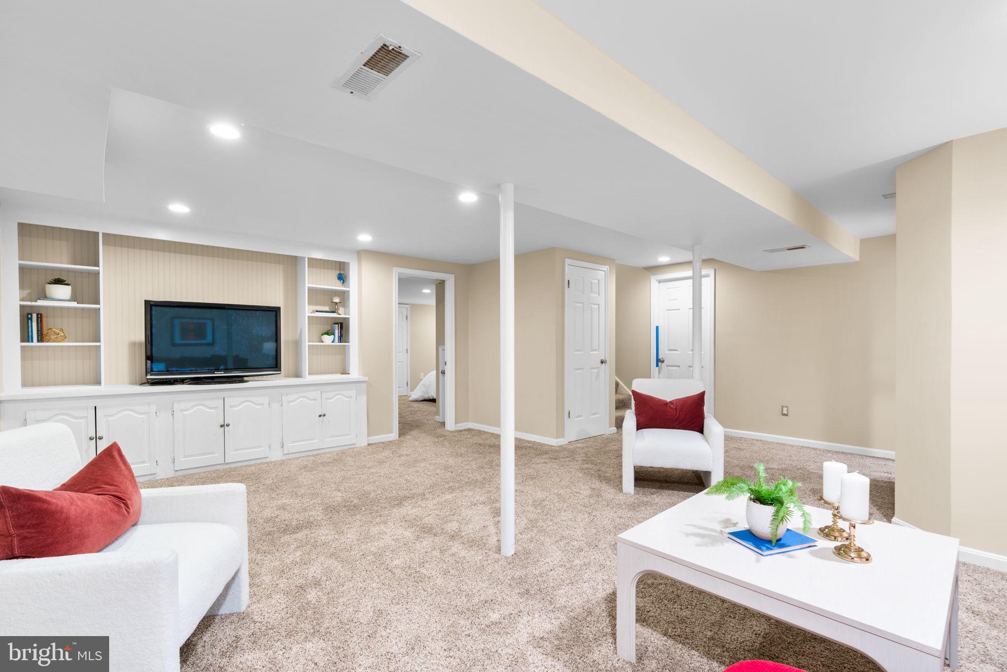 311 Canterfield Road Annapolis, MD 21403 - Photo 32 of 49 a living room with furniture and a flat screen tv