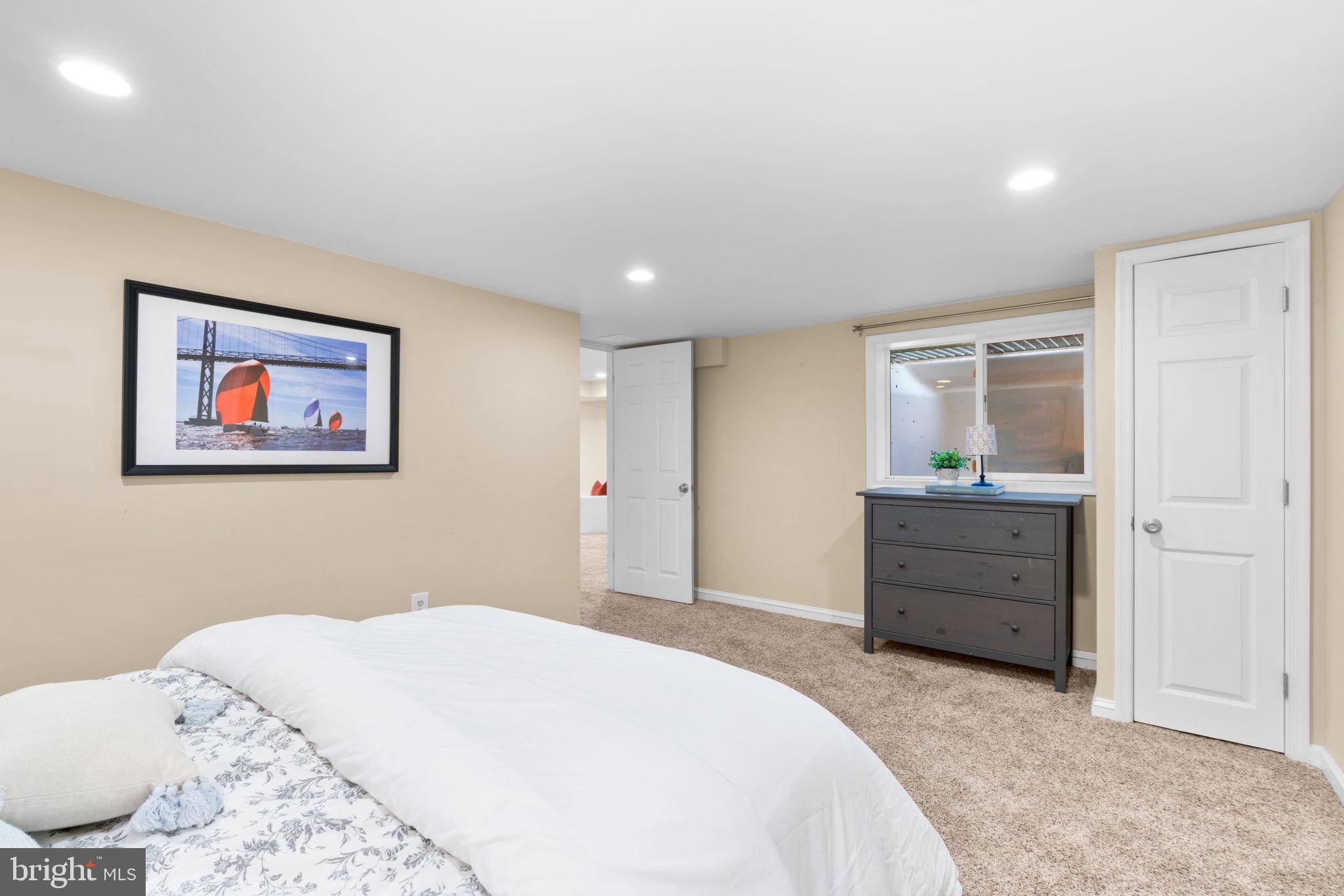 311 Canterfield Road Annapolis, MD 21403 - Photo 36 of 49 a bedroom with a bed and a dresser