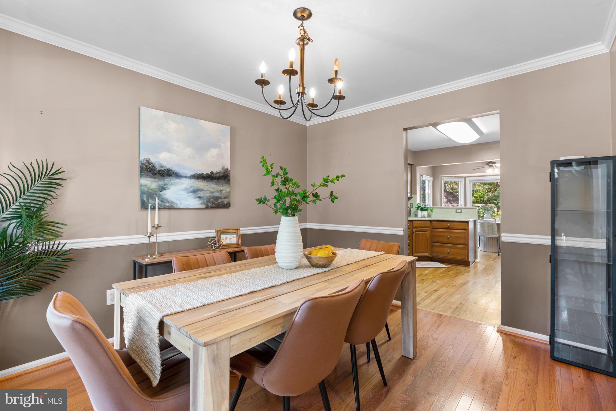 311 Canterfield Road Annapolis, MD 21403 - Photo 6 of 49 a dining room with furniture a chandelier and wooden floor