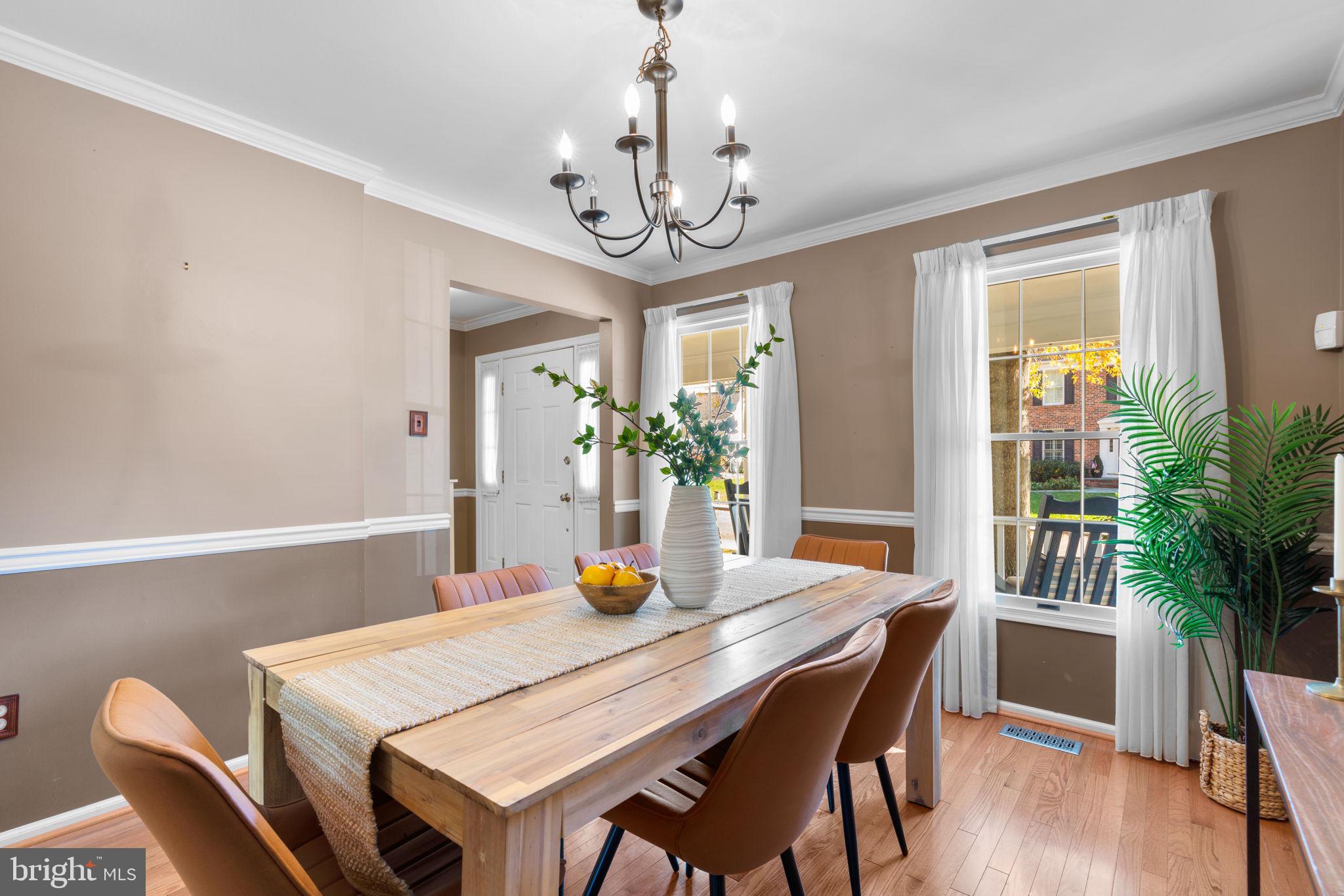 311 Canterfield Road Annapolis, MD 21403 - Photo 7 of 49 a view of a dining room with furniture wooden floor and chandelier