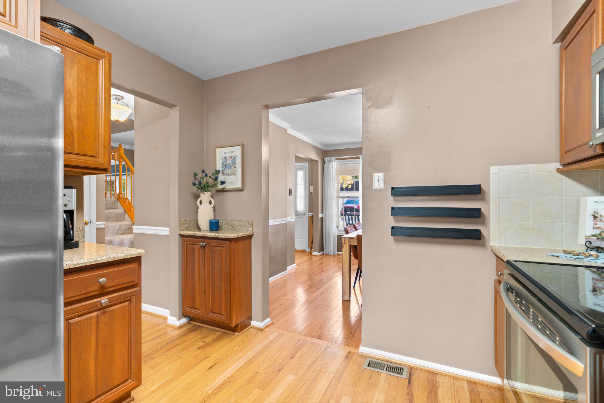 311 Canterfield Road Annapolis, MD 21403 - Photo 10 of 49 a kitchen with stainless steel appliances granite countertop a refrigerator and a stove top oven